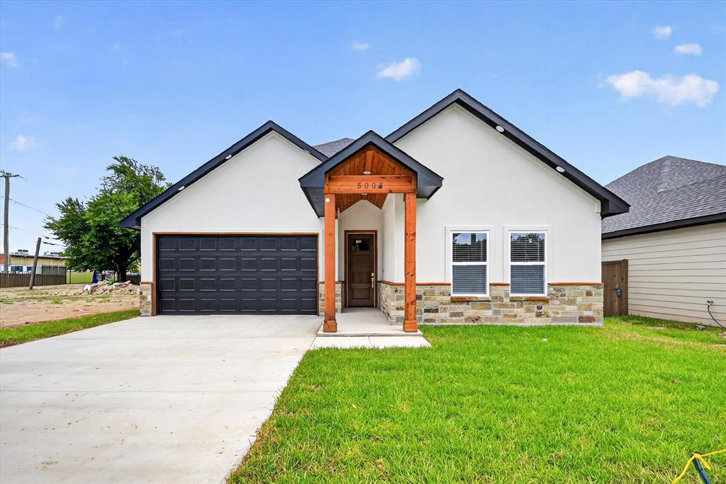 Welcome to this stunning 3 bedrooms and 2 baths new construction home where modern farmhouse charms meets upscale design! From the striking white stucco exterior with natural stone accents and cedar columns to the thoughtfully designed interior, every detail has been carefully crafted. Step inside the soaring vaulted ceilings accented with beautiful exposed wood beams, luxury wood look flooring and abundant natural light. The spacious living room flows effortlessly into the dining area and designer kitchen creating the perfect space for entertaining. The gourmet kitchen is the heart of the home, offering an oversized quartz island with custom wood detailing, quartz backsplash, gold hardware and fixtures, designer pendant lighting and a walk in pantry with decorative glass door. The main bedroom offers a beautiful tray ceiling, walk in closet, double vanity bathroom and a luxurious shower with gold and black accents. The secondary bedrooms are nicely sized with large closets. The backyard mature trees provide shade and  character to enjoy outdoor time with the family. The elementary school is just steps away. Come make this gorgeous house your home sweet home!