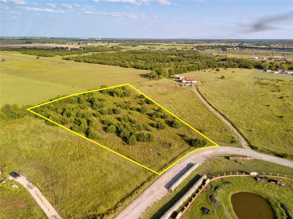 Wide-open 2.17-acre homesite in Caddo Mills with co-op water and electric available at the road and no deed restrictions, offering flexibility for residential, manufactured, or custom builds. This level parcel with light tree coverage provides a practical layout for development, with space for a primary residence, outbuildings, or recreational use. Located in Hunt County within the Caddo Creek area, the property offers direct access via a private gravel road and is positioned for both privacy and connectivity. Essential utilities are accessible, and the site is ready for septic installation, allowing a streamlined path from purchase to build. Located approximately 10 miles to Greenville (about 20 minutes), 25 miles to Rockwall (about 40 minutes), and 30 miles to McKinney (about 45 minutes), this location supports commuting while maintaining distance from higher-density areas. Everyday conveniences including grocery stores, dining, and retail centers are available within a short drive in nearby Caddo Mills and Greenville.
Outdoor recreation options include Lake Tawakoni, located about 25 miles east, known for boating and fishing access. The property is also served by Bland ISD, with campuses located within approximately 10 to 12 miles. This property combines usable acreage, utility access, and location flexibility in a growing North Texas corridor. Contact the listing agent to schedule a visit and review development options.