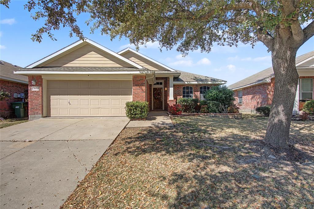 Welcome to 1042 Grimes Drive, a stunning and spacious 3-bedroom, 2-bathroom home nestled in the heart of the vibrant and family-friendly Travis Ranch community. Built in 2005, this 1,974-square-foot residence offers the perfect blend of comfort, style, and modern convenience, making it the ideal place for your family to create lasting memories.

As you step inside, you'll be greeted by an inviting and flexible floor plan that is completely carpet-free, featuring beautiful wood floors in the living areas and bedrooms, and elegant ceramic tile in the wet areas. The heart of the home is the expansive living area, complete with custom built-ins that add a touch of sophistication and provide ample storage. The adjoining dining room and additional living space offer incredible versatility, perfect for a home office, a dedicated playroom for the kids, or a cozy den for family movie nights.

The chef in your family will fall in love with the fabulous kitchen, which boasts a functional island, a spacious pantry, an eat-in breakfast area, and bar stool seating for casual meals. With plenty of cabinetry, you'll have all the space you need to store your culinary essentials. When it's time to unwind, retreat to the private primary suite, featuring a custom-designed closet that is sure to impress. The two secondary bedrooms are generously sized and share a well-appointed bathroom.

Step outside to your private backyard oasis, where you can relax and entertain under the charming pergola. The backyard offers plenty of space for kids and pets to play, and for you to cultivate your dream garden. The home also includes a 2-car garage, providing secure parking and additional storage.