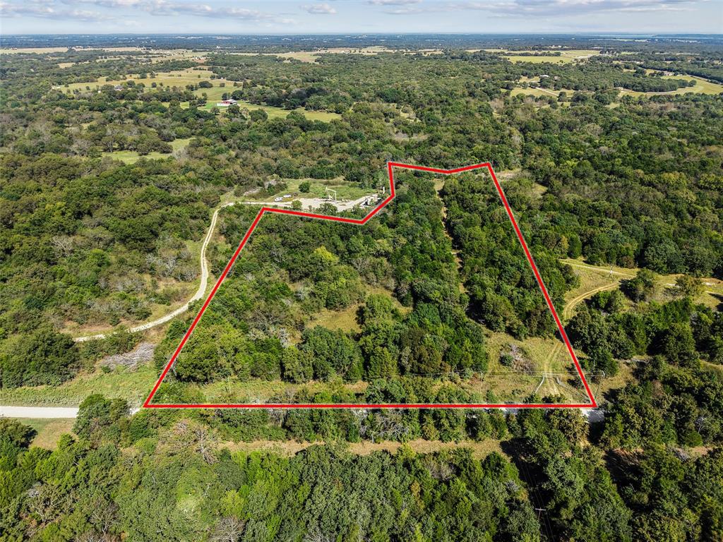 Qualifies for a 5% down financing program for buyers who meet the lender’s eligibility criteria. Discover 11 beautiful acres with over 500 feet of road frontage and backing to Sandy Creek! Located just west of FM 901 on Gilbreath Road, this property offers the perfect blend of privacy and natural beauty. Mature trees blanket the landscape, providing exceptional seclusion and the feel of a much larger tract. Enjoy abundant wildlife right in your backyard! Electric service is currently being extended to the property, and a Two Way Special Utility District water line is available at the road. Situated outside city limits, the property benefits from an agricultural exemption already in place. This is a rare opportunity to own a serene country escape with excellent accessibility and future potential. Additional acreage is available.