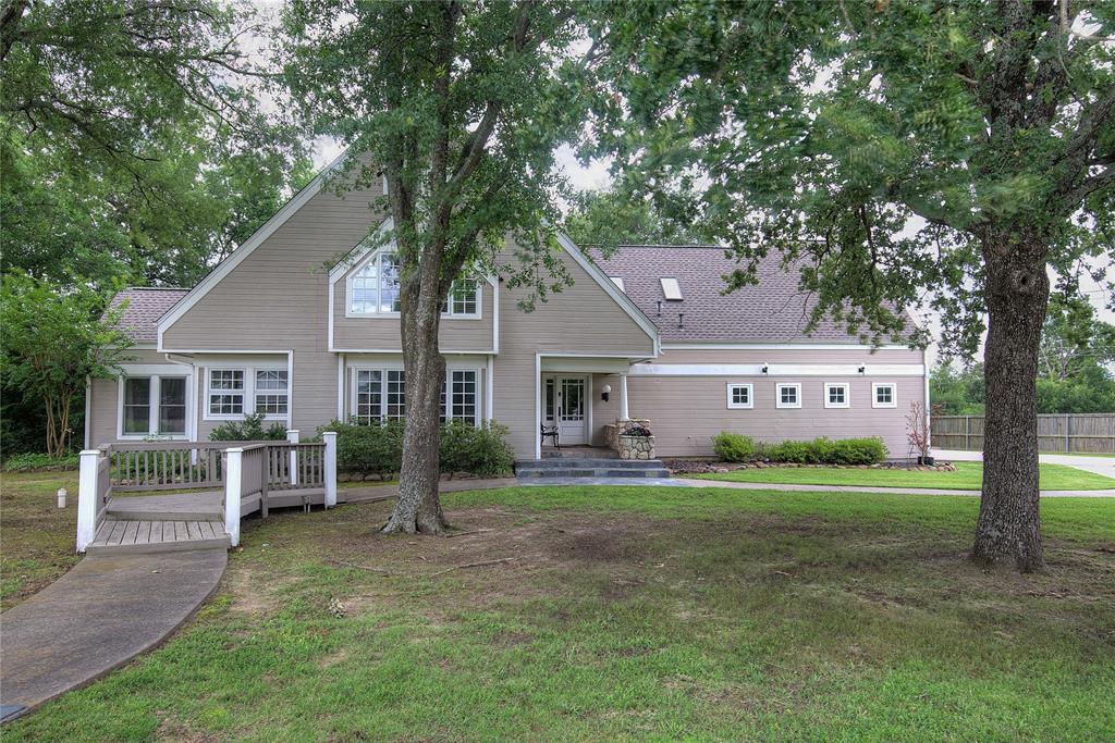 Welcome to 2 Jennifer Lane...A spacious and inviting home perfectly designed for busy families, entertaining, and everyday comfort.  Located in a quiet subdivision with friendly neighbors, This home sits just minutes from downtown, schools, and the hospital. The oversized one acre corner lot offers room to spread out with a covered front porch, two back decks, and a concrete walkway leading to a fire pit area...the perfect place to enjoy beautiful East Texas sunsets. Inside, the first floor features two living areas, two dining areas, a home office, mudroom, and an abundance of windows that fill the home with natural light. The kitchen offers a double apron sink, 5 burner gas range, and eat in kitchen booth for everyday living. Upstairs, you'll find four bedrooms and large laundry room. Two bedrooms include access to the third floor, bonus space ideal for a playroom or study area.  In addition, the third floor offers a game room or media room, creating even more flexible space for family, guest, or entertaining. Additional highlights include multiple hidden storage areas for seasonal decorations and oversized 3 car garage with work area and utility sink. Generous space and thoughtful layout for families with plenty of room for privacy, this home is truly built for making memories.