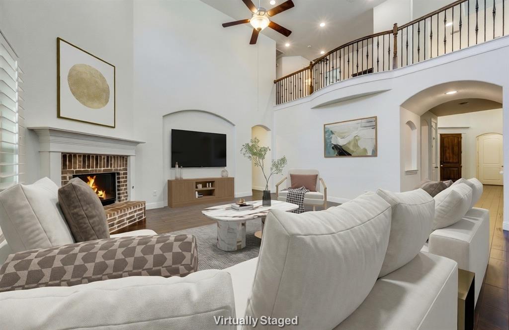 Located in the highly sought-after Argyle ISD, this beautifully maintained two-story home offers 5 bedrooms, 4 full bathrooms, and a dedicated office with an open living concept designed for comfortable living and entertaining. Hardwood floors run throughout the main level, and the living room features a gas fireplace and large windows with plantation shutters and solar screens for added energy efficiency. The interior has been freshly painted with new carpet installed upstairs. Step outside to enjoy the extended covered patio with approximately 200 sq ft of additional entertaining space, complete with built-in bar-height tables accented with Texas limestone, painted concrete, a pergola, and a wood-burning outdoor fireplace. Located in the award-winning Harvest community with pools, fitness centers, parks, playgrounds, fishing pond, year-round events, and convenient access to I-35, shopping, and dining.
