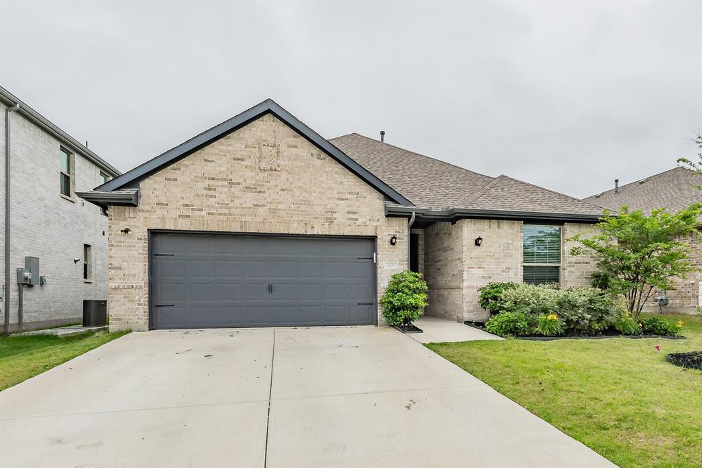 Spacious and well-designed 4-bedroom, 3-bath home in the Oakmont Park subdivision of Red Oak offering a versatile layout ideal for a variety of living needs. The primary suite is privately situated and features an ensuite bath, creating a comfortable retreat at the end of the day. A secondary bedroom also includes its own private ensuite, making it a great option for guests, extended family, or a dedicated office with added privacy. Two additional bedrooms are located in a separate hallway and share a full bath, providing a functional split layout. The open-concept kitchen, living, and dining areas serve as the heart of the home, offering a seamless flow for both everyday living and entertaining. The kitchen is equipped with granite countertops, modern cabinetry with generous storage, and a walk-in pantry to keep everything organized and within reach. Step outside to a covered back patio, perfect for enjoying morning coffee or hosting gatherings year-round. Located in Oakmont Park with convenient access to nearby shopping, dining, and major roadways, this home combines comfort, functionality, and a great location.