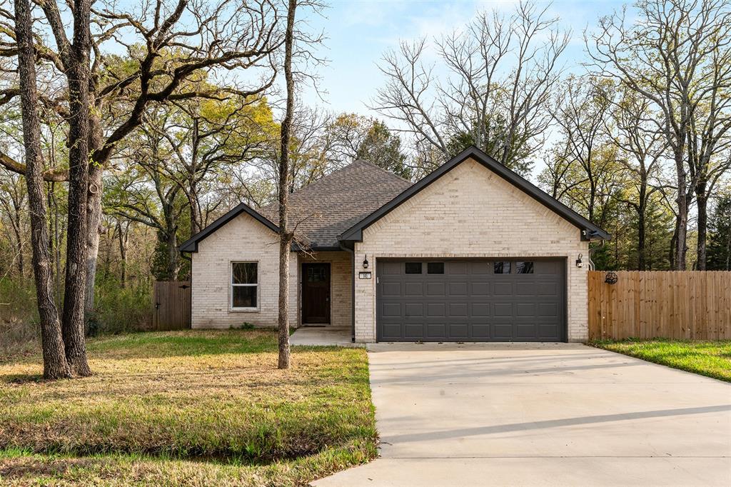 Now offering 2 lots! Newly built 3-bedroom, 2-bath home on 2 fenced lots featuring a desirable split floor plan and open-concept design in a quiet neighborhood at Cedar Creek Lake. The spacious living area flows into the kitchen and dining space, creating a comfortable layout for everyday living and entertaining. Tile flooring throughout the main areas adds both style and easy maintenance.

The primary suite offers a relaxing retreat with dual sinks, a separate tub and shower, and a large walk-in closet. Two additional bedrooms are located on the opposite side of the home, providing privacy for family or guests. Additional features include a separate utility room, 2-car garage, and a covered back patio sitting on 2 fenced lots making it a great backyard for family and pets and perfect for enjoying the outdoors.
  Residents enjoy access to a nearby HOA park and boat ramp, making it easy to enjoy Cedar Creek Lake. Low HOA dues add to the appeal of this peaceful lake-area neighborhood.