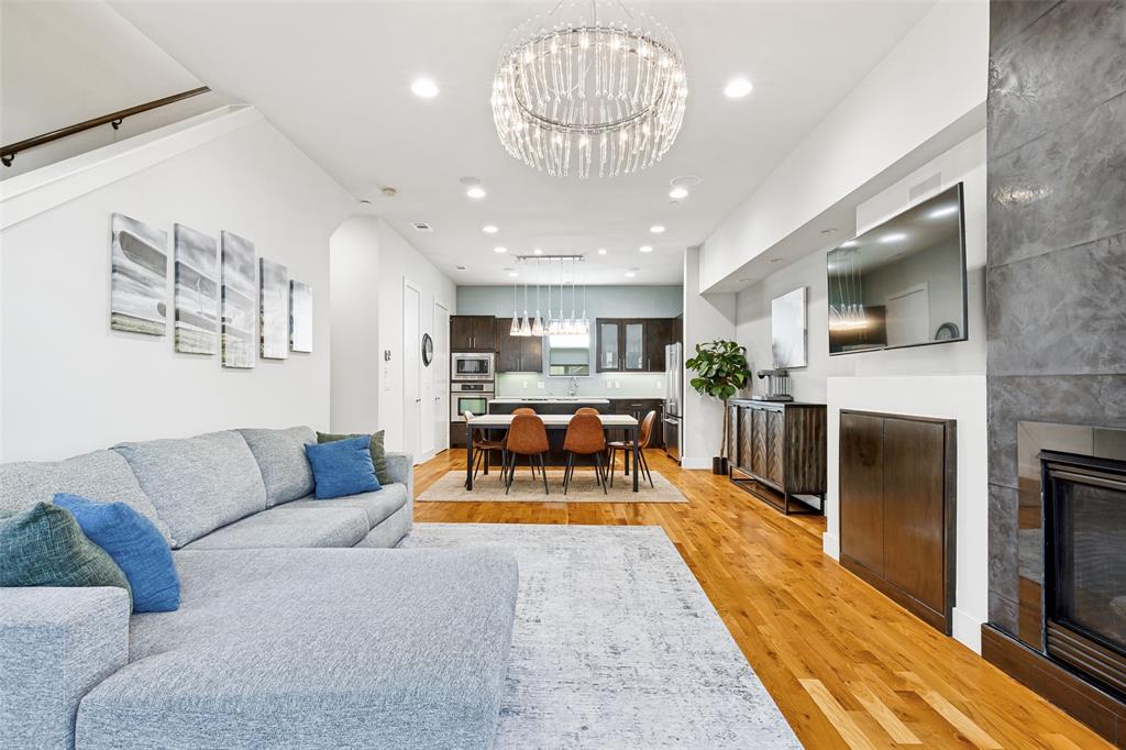 Experience elevated urban living in the heart of Oak Lawn - Cedar Springs, where timeless design meets modern functionality. This meticulously crafted 2-bedroom, 2 full bath, 1 half bath residence with a private 2-car garage offers a rare combination of high-end materials, architectural detail, and prime Dallas location standing apart in today’s market of builder-grade construction.

Spanning approximately 1610 square feet, the open-concept living space is anchored by true oak hardwood flooring, expansive walls of windows, and a statement fireplace with custom built-in cabinetry, creating a warm yet sophisticated atmosphere ideal for both everyday living and entertaining.

The chef-inspired kitchen features custom European-style maple cabinetry, Italian quartz countertops, and a designer Ann Sacks tile backsplash, complemented by Jenn Air stainless steel appliances and seamless flow into the dining and living areas.

The primary suite delivers a spa-like experience with a custom maple vanity, quartz counters, and imported porcelain tile with glass accents, while the guest suite offers a furniture-style vanity and spacious walk-in shower both thoughtfully designed with elevated finishes rarely found at this price point.

Additional highlights include:

Stained concrete floors on the first level for durability and modern appeal
Whole-home surround sound system for an elevated entertainment experience
Pre-wired security system and CAT5 connectivity
Expansive rooftop deck ideal for entertaining and enjoying city views

Constructed with a stone veneer and stucco exterior, this home reflects a level of craftsmanship and material quality that stands apart from today’s cost-driven builds.

Located just minutes from Uptown, the Dallas Design District, and some of the city’s best dining, nightlife, and walkable amenities, this is a rare opportunity to own a residence that combines location, quality, and lifestyle.