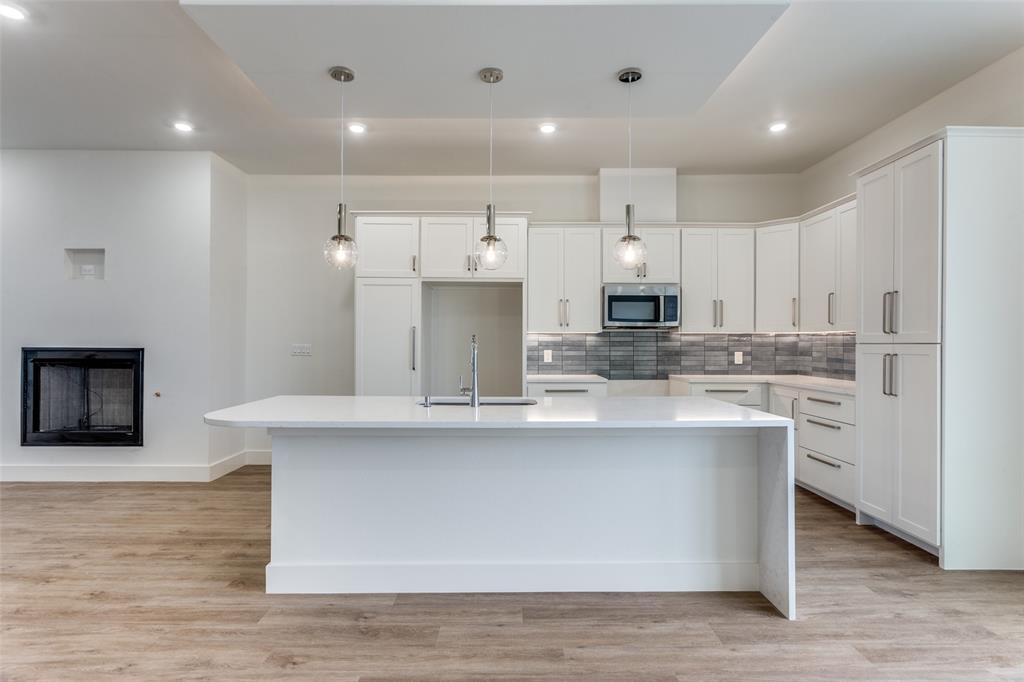 Introducing a limited collection of contemporary townhomes in the heart of Fort Worth’s Near Southside — an opportunity to be part of something truly special from the very beginning. Thoughtfully designed for a sophisticated urban lifestyle, this boutique community blends clean architectural lines with modern functionality and elevated design. Only two residences are being released at this time, offering early buyers the rare chance to secure a home in a highly anticipated development surrounded by Fort Worth’s most exciting growth. Each home features an open-concept floor plan filled with natural light from oversized windows, soaring 10’ ceilings in the main living area, and a seamless indoor-outdoor connection with a second-story seating area overlooking the private courtyard. Every detail reflects intentional living — from quartz countertops and stainless appliances to LED lighting throughout and flexible closets at each level designed for potential elevator conversion. The primary suite offers a refined retreat with a soaking tub, glass-enclosed shower, double vanities, and a spacious walk-in closet, while generous storage enhances everyday comfort. Residents will enjoy a shared patio and grill area, creating a welcoming space for gathering and connection. Energy-efficient features include a high-efficiency SEER 15 High Efficiency HVAC system, gas cooking, fireplace, dryer and tankless water heater, Low-E windows, and Energy Star roof tiling — delivering both luxury and long-term efficiency. Perfectly positioned between Downtown Fort Worth and the vibrant energy of West Magnolia Avenue, this location offers effortless access to TRE and TEXRail along with the acclaimed dining, entertainment, and cultural destinations of South Main and Magnolia. Experience the advantage of early ownership in one of Near Southside’s most exciting new communities. Do yourself a favor and see the staged 2-BDRM next door - #337 corner townhome.