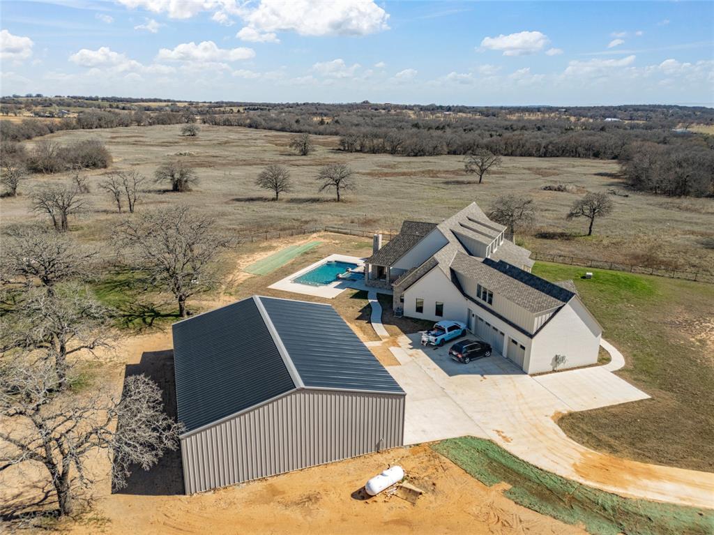 Welcome to 623 Lake Valley Road featuring a brand-new modern farmhouse sitting on 82 beautiful acres of secluded country land. This nearly 5,000 sqft home has never been lived in and offers 4 bedrooms, 5 bathrooms, and a spacious open layout built for comfortable country living.

Step outside to a huge back patio overlooking a stunning in-ground pool, perfect for relaxing after a long day or entertaining friends and family. The property also features a newly finished barn or shop that provides excellent space for equipment, hobbies, or ranch use.

With 82 Ag Exempt acres of private land surrounding the home, there’s plenty of room for livestock, recreation, or simply enjoying the peace and quiet of the countryside. Properties with this much land, a brand-new home, and quality improvements are hard to find.