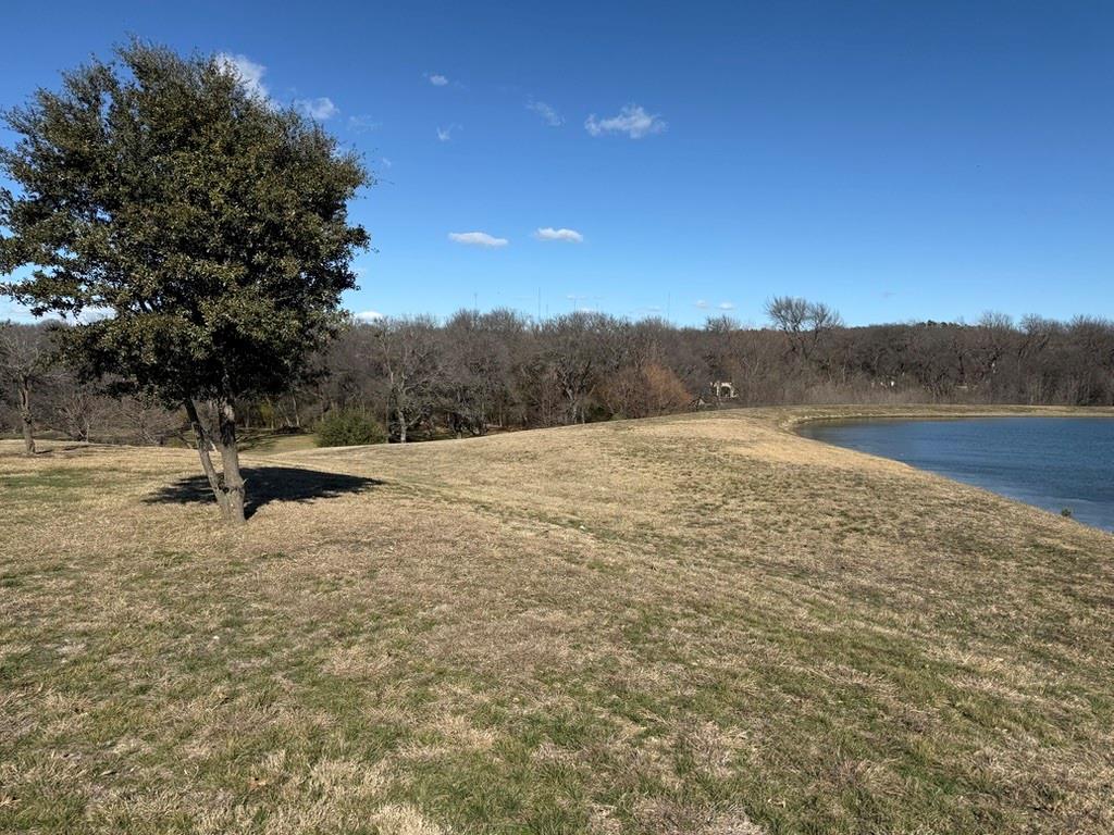Welcome to the prestigious, gated community of The Timbers of Lake Ridge. Located within the highly acclaimed Midlothian ISD, backing up to a tranquil creek setting, the rare opportunity to bring your own builder and design a custom estate tailored to your lifestyle.The property features mature trees, views of adjacent pond, and all utilities already in place, allowing for a seamless building process. Enjoy the privacy and exclusivity of luxury living while remaining conveniently located approximately 45 minutes from DFW International Airport, Downtown Dallas, and Downtown Fort Worth. Create the home you’ve always envisioned in one of the area’s most sought-after communities, where elegance, space, and natural beauty come together. Can be sold with adjacent property MLS#21145904