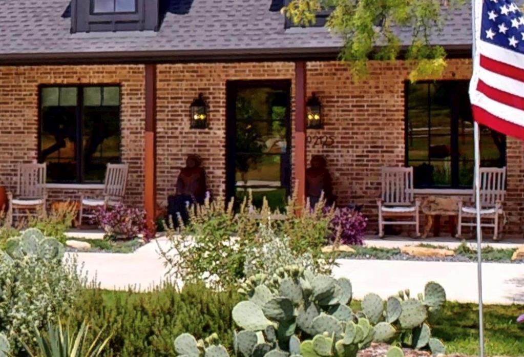 Beautiful 4+ acre property featuring custom, one owner, 4-bedroom home plus a 24 x 24 heated and cooled insulated shop with covered patio. The impressive full-glass front door welcomes you into a home with high ceilings, tall doors, and quality finishes throughout. Large windows fill the home with natural light, creating a bright & inviting atmosphere. Just off the entry is a flexible office or formal dining room. The open great room features a fireplace and flows into the gourmet kitchen with built-in refrigerator & freezer, induction cooktop, double ovens, ice maker, walk-in pantry, & abundant cabinetry. The main floor offers 3 bedrooms and 2.5 baths, including a spacious primary suite with huge walk-in shower, dual sinks, (Electrical outlets bathroom drawers)plenty of storage, & large walk-in closet with direct access to laundry room. 
The back hall includes a mudroom and leads to the oversized 2-car garage plus workshop area. Upstairs is a private guest suite with a full bath. Dog wash station. Extended home & appliance warranty, Pella window & door warranty.
The Hills Above Gated neighborhood offers a clubhouse with fitness center, infinity pool, as well as a lakefront cabin with restrooms and covered patio, community dock, boat launch & boat storage. Annual dues are only $950. 
Enjoy your morning coffee on the inviting front porch that captures the morning sun, or entertain family and friends on the oversized back patio overlooking the fenced backyard. Beyond the backyard, explore the beautiful God-created creek that runs behind the property, with acreage extending into the creek area. This is a rare opportunity to enjoy the comfort of a custom home, the convenience of a great shop, and the beauty of acreage living.  Other great features are Pella windows and doors, Magna blinds throughout, Concrete driveway, sidewalks around whole house, Concrete pad for the fire pit, fenced enclosed back yard & attic spray foam insulation. 220 Eectrical outlet in shop.