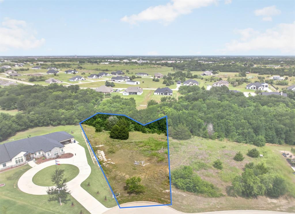 Build your dream home on this beautiful 1.355-acre cul-de-sac lot in the sought-after Vista Oaks Estates community. Nestled among mature trees and backing to a heavily wooded greenbelt, this exceptional homesite offers the perfect balance of privacy, natural beauty, and upscale country living. The irregular lot shape creates a unique building opportunity with plenty of room for a custom home, pool, workshop, or outdoor entertaining space.

Enjoy peaceful views of the surrounding countryside while being just minutes from I-30, providing convenient access to Rockwall, Greenville, and the greater Dallas-Fort Worth metroplex. Surrounded by established custom homes on acreage lots, this property offers a rare chance to create your own private retreat without sacrificing modern conveniences. Located in Royse City ISD and within a community featuring spacious estate-sized lots and a low HOA