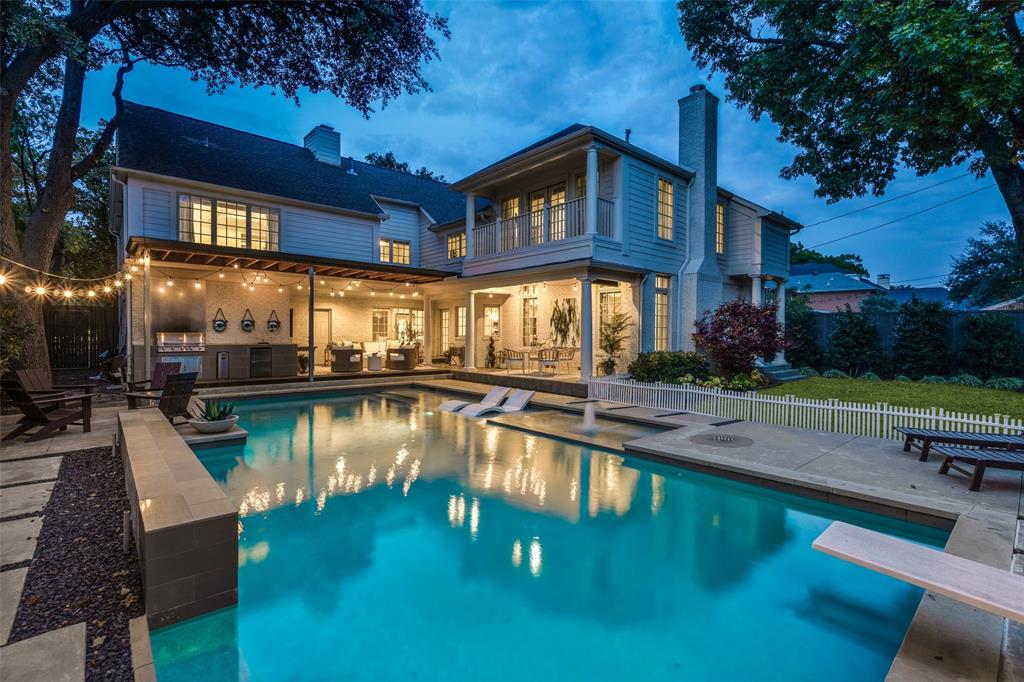 Stunning Five Bedroom Traditional in HPISD on an Oversized 77x160 Lot! Taken to the Studs and Expanded by 2,235 sq ft in 2006 with Designer Finishes! Move-In Ready! 
Welcome to 7712 Southwestern, an elegant and beautifully updated home in Highland Park ISD. This exceptional property blends timeless traditional style with fresh designer touches throughout. Step inside the bright, spacious main level featuring a large living room with a cozy fireplace, a private office with built-in storage, and two convenient half baths. The open kitchen flows seamlessly into the breakfast room and family room, all overlooking the stunning pool and landscaped backyard, perfect for everyday living or entertaining. Upstairs, retreat to the luxurious primary suite with two walk-in closets, a sitting room, a cedar closet, and a serene, private atmosphere. Four additional generous secondary bedrooms and a large game room offer plenty of space for all.Outside, enjoy mature landscaping, an inviting dream backyard complete with multiple seating areas, a 40 ft long pool with hot tub, wet deck and diving board, covered patio, outdoor kitchen with 5 burner built in grill, a play yard, and a gas line for outdoor fire pit — ideal for relaxation and recreation. Additional special features include: Pella casement windows, draperies and privacy shades, whole house instant hot water circulating pump, Control4 smart home automation, ample storage with bonus closets in — game room, linen closet, 2 hallway closets, and an outdoor closet, full cavity foam insulation on all exterior walls, and a turnaround driveway with parking for three additional vehicles. Meticulously maintained, this home is truly move-in ready with beautiful details. A must-see property in one of Dallas’ premier neighborhoods!