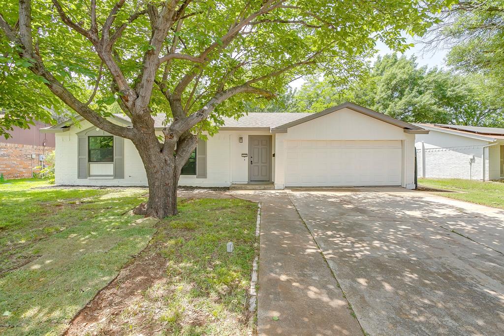 Recently updated 3 bedroom, 2 bath home in Crowley ISD.  Vinyl wood flooring throughout. Family room with vaulted ceiling open to breakfast nook and kitchen.  Kitchen has tiled backsplash, breakfast bar, quartz countertops, and sliding window overlooking backyard. Primary bedroom has ensuite with a vanity with quartz countertop and a walk-in shower.  Guest bath also has a vanity with quartz countertop. Freshly painted brick exterior and trim. Large backyard with covered patio.