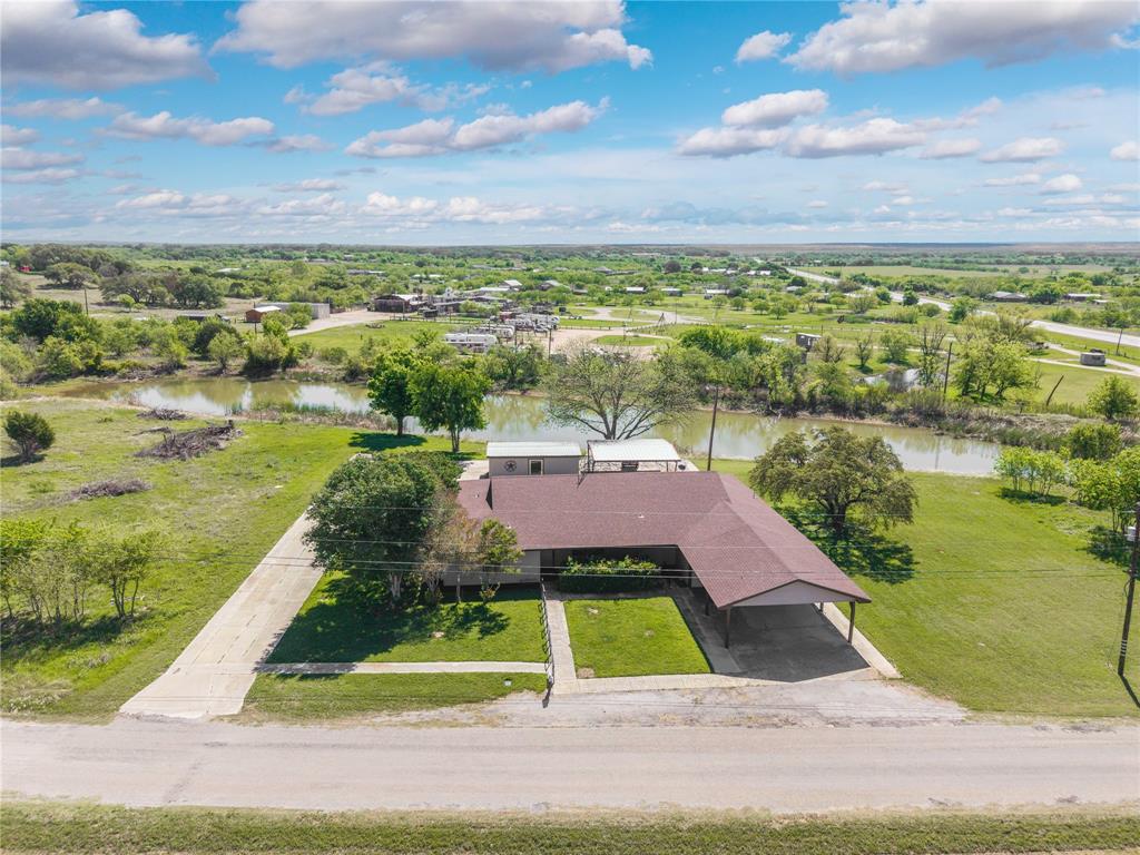 Welcome to your private slice of country living at 100 CR 319 in Early, TX! Situated on 5.6 beautiful acres, this property offers the perfect blend of space, comfort, and peaceful seclusion. 

This charming 3-bedroom, 2-bath home features an inviting open-concept layout, where the spacious living room flows seamlessly into the dining area and kitchen. The kitchen is designed with both functionality and gathering in mind, complete with a large island that provides additional seating and prep space—perfect for hosting family and friends.

Each bedroom is generously sized, offering comfort and flexibility, while the abundance of storage throughout the home ensures everything has its place. You’ll especially love the large walk-in closets that provide plenty of room for organization and convenience.

Step outside and enjoy the true highlight of this property—a picturesque pond right in your backyard, creating a serene setting for relaxing evenings or peaceful mornings. The home also features both a front porch and a back porch, ideal for soaking in the quiet surroundings and enjoying the natural beauty of the land.

For those who love to entertain, the covered outdoor area in the back is perfect for gatherings, barbecues, or simply unwinding. Additionally, a versatile storage shed offers endless potential—it could easily be transformed into a workshop, home office, or even your dream outdoor kitchen space.

Parking is never an issue with a 2-car garage, a 2-car carport, and ample additional space for guests, trailers, or recreational vehicles.

If you’ve been searching for a property that offers space, privacy, and endless possibilities, this one checks all the boxes. Come experience the peaceful lifestyle this beautiful property has to offer!