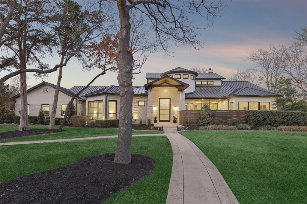 Set on 2.3 fully fenced, usable acres in private Southlake cul-de-sac, this rare modern estate delivers an almost impossible combination: land, Carroll ISD open enrollment, a newer custom home, no HOA, and resort-style amenities at a value well below replacement cost.  Built in 2016, the single-story main residence was thoughtfully designed for modern living and effortless entertaining. A light-filled, open floor plan flows seamlessly to the outdoors through massive panoramic sliding doors, opening to a covered patio with new motorized screens, creating true year-round indoor-outdoor living.  The main home features three oversized, master-sized bedrooms, each with en-suite baths, a dedicated office, and a generous bonus space that can easily convert to additional bedrooms, media, or flex living, offering long-term adaptability without compromise. Additional highlights in the main home include, foam insulation, a full house water filtration system, EV charger, stack dishwasher, separate laundry room in primary bedroom, and thermostats in each bedroom for added convenience. Outdoors, the property truly distinguishes itself. The grounds are fully utilized and designed for lifestyle, featuring mature hardwood trees, a turf soccer field, brand-new fenced pickleball court, expansive play areas, a resort-style pool and spa, and a storage barn for recreational gear and equipment, all within a setting that feels private, peaceful, and rare for Southlake.  With no HOA, sidewalks leading to nearby walking trails, and a quiet cul-de-sac location, the setting offers both freedom and refinement.  As a bonus, the estate includes additional independent living quarters, ideal for multi-generational living, guests, or future flexibility without detracting from the primary home’s elegance and cohesion.