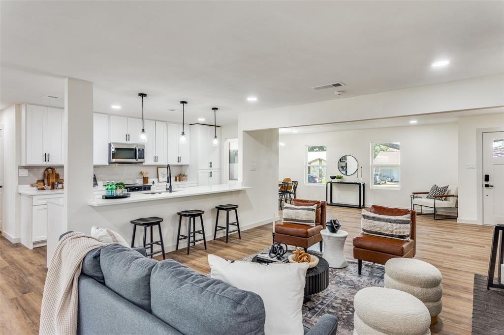 Located in an established neighborhood just minutes from TCU and Lockheed Martin, this property offers the luxury and feel of a new construction paired with the charm of a mature community. The open-concept layout is perfect for modern living and entertaining, featuring keyless entry, brand-new interior and exterior paint, and 20-mil SPC luxury vinyl flooring throughout. 

The living area is anchored by a sleek modern electric fireplace, creating a warm and stylish focal point. The custom-designed kitchen is a true showstopper, showcasing fully renovated cabinetry, luxury quartz countertops, a double sink, brand-new garbage disposal, and brand new appliances from Best Buy, including a Samsung Bespoke slide-in electric range with precision knobs. The dining area is elevated with a striking modern chandelier, adding to the home’s upscale appeal. Both bathrooms have been fully remodeled with double vanities, luxury tile finishes, modern cabinetry, quartz countertops, and new fixtures. The primary suite also features a large double closet, offering both comfort and functionality. Additional upgrades include new plumbing, electrical, doors (including the front door), a brand-new water heater, and an insulated, fully renovated garage with 4-foot LED ceiling light fixtures. 

Both the roof and HVAC system are in great condition, ensuring year-round comfort. Step outside to a large backyard with endless potential for entertaining, outdoor living, or future expansion. Solid wood beams at the front entry enhance curb appeal and welcome you home. Bonus: a 12-month Home Owners Warranty is included at closing.

Conveniently located near major employers, dining, shopping, and entertainment. Schedule your private showing today!