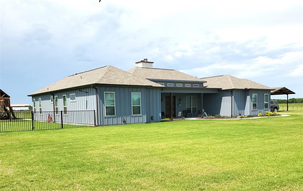 HUGE PRICE REDUCTION!! SELLER IS HIGHLY MOTIVATED!!  Welcome to Country Living at its finest! You have to come and see this Beautiful 2-Year-Old Custom Home with its Open Floor Plan and 14' Ceilings. The property is 1.268 Acres. The home is 2618 sqft, 4 Bedrooms, 3.1 Bathrooms, Separate Office, Plus a Separate Detached Apartment or Mother-In-Law Suite. There are 2 Primary Bedrooms with En-Suite Bathrooms on opposite sides of the home. This could be a Multi-Generational Home. There is an abundance of natural light. The Living Area has 2 Double Sliding Door Entrances to the Outdoor Living Space-Atrium. The Kitchen has an Oversized Granite Island for Family Gatherings and Sliding Door Entrance to the Outdoor Living Area. The Outdoor Living Space-Atrium has an Outdoor Fireplace and a New exquisite Outdoor Kitchen with Granite Countertops and is a Great Place for Friends and Family Entertaining. There is a New 1700 sqft Workshop Building that includes 528 sqft that is set up as an Apartment or Mother-In-Law Suite, but could be utilized as a Man-Cave, Game Room, Craft Area, etc. The inside of the Workshop Area is plumbed for Water and Gas also. The Backyard is ready for Entertainment with a Grand Children's Play Center. The Backyard is Fenced and Cross Fenced. There are light Deed Restrictions and Horses & Cattle are Allowed. This home is less than an hour to the DFW Metroplex, 30 minutes to McKinney, and two new North Texas Lakes are close by.  PLEASE NOTE:  This will be a Short Sale and will be per lenders approval of contract.