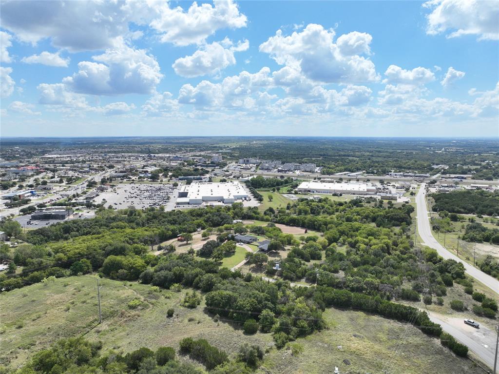 Prime 20± Acre Commercial Development Opportunity – Weatherford, TX

Located at 1945 Tin Top Road just north of Interstate 20, this exceptional 20-acre C-2 zoned commercial tract offers outstanding visibility, access, and development potential in the heart of Weatherford, Texas. Positioned at a major intersection, the property benefits from strong traffic counts and proximity to the DFW Metroplex.

The City of Weatherford provides 12” water service, electric, and an 8” wastewater line to the property, making it well-suited for immediate commercial development. C-3 zoning allows for a wide range of uses including retail, office, hospitality, restaurant, medical, and mixed-use projects (buyer to verify).

The site is located near Weatherford’s primary retail corridor and is surrounded by established national and big-box retailers including Walmart Supercenter, Target, Lowe’s, Home Depot, Costco, Kohl’s, H-E-B, PetSmart, Ross, Best Buy, and numerous restaurants and service providers. This strong retail presence underscores the area’s sustained consumer demand and commercial growth.

Parker County is one of the fastest-growing counties in Texas, driven by population growth, business expansion, and continued residential development. As the county seat, Weatherford serves as the regional commercial hub and continues to attract new investment.

This is a rare opportunity to acquire a large, well-located commercial tract with utilities in place in a rapidly expanding North Texas market.