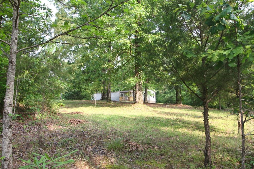 Almost New!  2020 Manufactured home, sitting on a very private acre on top of the hill.  This is a 2 bedroom, 2 bath home.  It has new decks, paint, floor coverings, and many new fixtures.  It is completely move in ready.  Home should qualify for FHA, or Rural Development financing, could be zero down!  Call and schedule an appointment today!