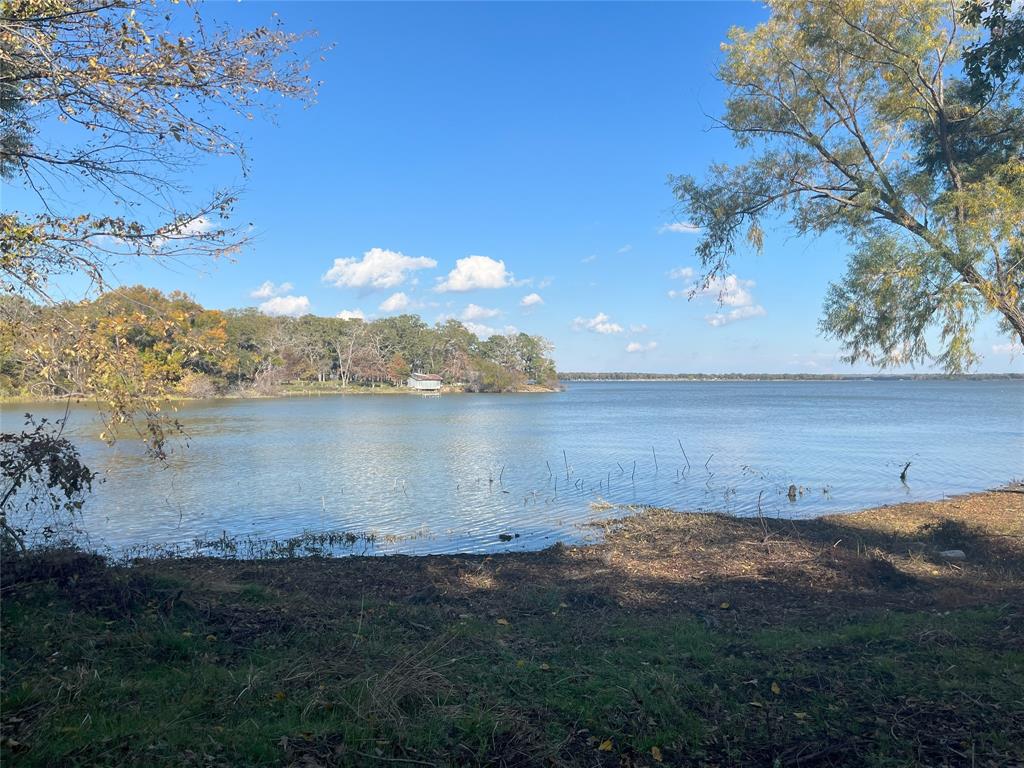 **Must See**Lake Front*Outside City Limits! Build Your Dream Home & Enjoy the Breathtaking View of the Lake! This Beautiful 1 Acre Lake Lot & .5 acre SRA leaseback is quiet and has plenty of mature trees. Nautical Shores is off Lake Tawakoni! Nautical Shores offers lakefront living convenient for boating, fishing, swimming & much more!. Lake Tawakoni State Park has several boat ramps & marinas. Convenient to shopping & restaurants in Greenville, Rockwall & Tanger Outlets in Terrell. Less than an hour from North Park Center in Dallas. Choose your own builder. HOA Fees $600 annually, Boat Slip is $500 annually, Sabine River Authority Leaseback is approx. $50 annually,with an approved permit,SRA allows a pier up to 150ft and a boat dock. HOA requires a single story home to be min. 1,400sqft and a two story to be min. of 1,800sqft.See HOA Declarations,building restrictions&Vicinity Map in the Transaction Desk.No Survey.Use GPS coordinates to find Lot(32.9434787, -96.0179778)Sign on Lot.