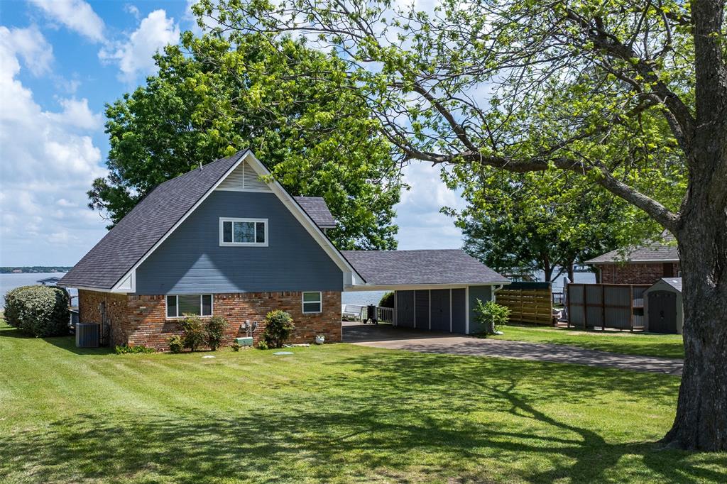 Enjoy a great view of the upcoming 4th of July Thunder Over Cedar Creek Lake Airshow from this property! Experience lakefront living at its finest in this 1,700 square foot, 3-bedroom, 2 bath wide-open waterfront home, where breathtaking open water views set the stage for unforgettable sunrises thanks to its desirable East-facing orientation. Wake up each morning to shimmering light across the water and enjoy cooler, shaded evenings—perfect for relaxing or entertaining by the lake. This well-maintained home offers the ideal blend of peaceful seclusion and convenient access to some of the area’s most popular destinations. Spend weekends wine tasting at Triple-N Ranch Winery, enjoying dining at The Whistle Stop Restaurant, or savoring upscale cuisine at Fig's Steakhouse & Backyard. Local favorites like Plowboys Restaurant are just a short drive away, offering that classic small-town charm and comfort food. When you’re ready to explore beyond the lake, you’re conveniently located near the vibrant communities of Athens and Corsicana, where you’ll find shopping, entertainment, and additional dining options. Whether you’re looking for a weekend retreat or a full-time waterfront escape, this property delivers the perfect combination of location, lifestyle, and lakefront beauty. Recent updates include: Bathrooms and Kitchen & New HVAC (2025), New deck (2024), and LVP flooring (2021). The successful purchaser will have option to buy an additional off-water lot, located directly across the street from the waterfront - perfect for permitted structures (GEO# 3245.0000.5920.60).