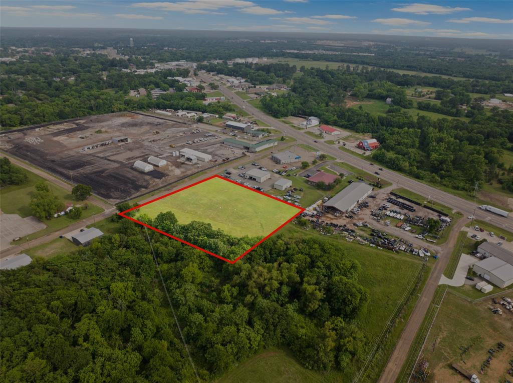 Great commercial opportunity in a convenient in-town location! This 2.4 acre vacant lot offers excellent potential for a variety of business uses, with easy access to a nearby high traffic roadways including I-30, while maintaining a slightly more private setting for operations.The property provides ample space for development, parking, or expansion, making it ideal for office, retail, or service-based businesses.Whether you're looking to build now or invest for future growth, this property presents a solid opportunity in a growing area.
