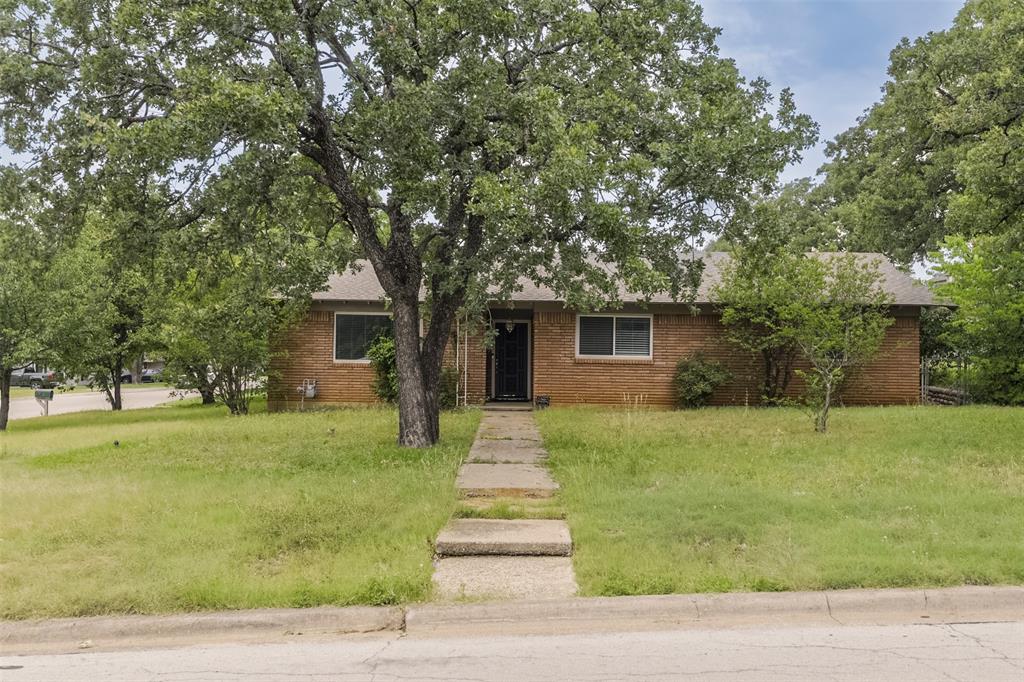 Location, Location, Location!! This Charming 3 Bedroom, 2 Bath Home Provides Convenient Access to Shopping, 183, 820, and the DFW Metroplex. This Classic Floorplan Offers Plenty of Space and Storage with a Bonus-Flex Room, Updated Kitchen and Bathrooms, Large Family Room and Spacious Bedrooms. The Kitchen Features Granite Countertops, Tile Backsplash, Electric Cooktop, and Ample Cabinets. The Family Room Features Vaulted Ceilings, Decorative Beams, Cozy Wood Burning Fireplace with Vintage Brick. Three Bedrooms Offer Roomy Accommodations, Including a Primary Suite with Walk-In Closet, Vinyl Plank Flooring, and Private Bath with Walk In Shower.  A Deep 2-Car Garage and Large Storage Closet Provides Extra Space. Enjoy the Mature Trees of the Backyard and Shed for Additional Storage of Tools or Hobby Supplies. Located In Birdville Schools. All this Gem is Missing is YOU!!