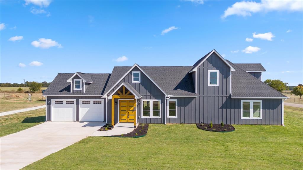 Stunning new modern farmhouse in Dixie Estates. This 3-bedroom, 4-bath home sits on 1+ acre of unrestricted land just outside city limits, with no HOA. The open floor plan features a spacious living room with 19-foot cathedral ceilings and large windows, filling the space with natural sunlight. High-end finishes include quartz countertops, hardwood floors, and LED lighting throughout.  The gourmet kitchen boasts stainless steel appliances and a range hood. The primary suite features a luxurious freestanding tub and walk-in closet. Additional amenities include spray foam insulation, a sprinkler system, covered porch and a 24x24 garage. Enjoy this modern rustic living, just 13 mins from Lake Texoma and 20 mins from Sherman.