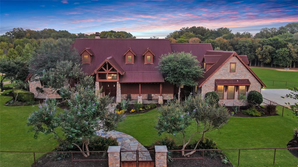 Enjoy private tranquility in this rural gated estate in Anna.  Exquisite 3bed, 2bath luxury ranch-style custom home sits on 10 picturesque acres, blending rustic charm with modern amenities. Stunning stone fireplace is the focal point of the welcoming living area overlooking private backyard pond & outdoor living space. Chef's kitchen with grand island & high-end appliances perfect for gatherings & entertaining. Private primary suite features incredible stone tub & large walk-in shower with spacious custom closet. 2 separate ensuite guest rooms allow for privacy & comfort. 12-seat media room offers the perfect setting for movie nights & game day gatherings. Stunning library with floor to celling bookshelves & stone fireplace provides ideal space for work or relaxation. Barn structure with small apartment provides space for workshop, stable or guest quarters. On-site stocked pond & pasture for livestock. Enjoy rural living with covenant protections. 90 additional acres also available.