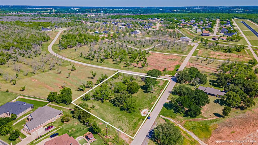 1.9 Acre Premium Corner Lot with Mature Oak and Pecan Trees. Located in THE LANDINGS AIRPARK in Pecan Plantation near Landing Strip and Taxi Ways. Great opportunity to build your Custom Home and Private Out Building, while enjoying the resort like amenities and conveniences. 2 Swimming Pools, 2 Golf Courses, 2 Air Parks, Club House with Restaurants, Fitness, Tennis, Walking Trails, Equine Area, RV Camping, Multiple Parks, Banking, Shopping, and so much more.