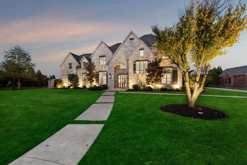 Custom-built home by Jeff Pfeifer offers 5 beds, 6 baths, nestled on a sprawling 1.5-acre plot. The property boasts an array of amenities including a sports court, football field, & a heated pool with a spa. Enjoy evenings around the fire pit with built-in seating or relax in comfort with the outdoor remote-control sunshades. A well for irrigation ensures lush landscaping, while the outdoor kitchen is perfect for al fresco dining. Inside, the primary suite, secondary bedroom with ensuite bath, & office are conveniently situated on the 1st floor. Upstairs, 3 generously sized bedrooms with vaulted ceilings & ensuite baths offer privacy and comfort. Gather in the combined kitchen & family room with a stone fireplace & custom built-in or unwind in the expansive game room illuminated by floor-to-ceiling windows. This home boasts hardwood floors, tall ceilings, and designer lighting, creating an ambiance of elegance & warmth. Located within the esteemed Prosper ISD, this home is a must see!