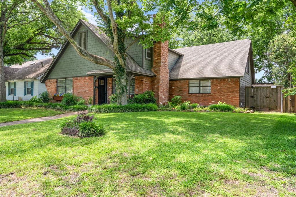 Beautifully updated cottage-style home with beautiful landscaping and mature trees is conveniently located near IH-635, the Dallas Athletic Club, shopping, dining, and major commuter routes. This spacious 5 bed, 2 bath home blends charm, functionality, and modern updates throughout. The kitchen features granite countertops, stainless steel appliances, ample cabinetry, and opens seamlessly into the living and dining areas. Both bathrooms have been tastefully updated, while laminate wood flooring runs throughout the home with no carpet anywhere. The inviting living area showcases a classic brick fireplace, creating a warm and welcoming focal point. Major system updates include Fiber Cement exterior siding, roof, HVAC, and water heater, which offer added peace of mind for the next owner. Upstairs, you’ll find an incredible bonus sunroom filled with natural light, complete with abundant shelving and closet storage. Perfect as a game room, craft room, studio, or flex space, but not included in the square footage due to the absence of central HVAC. An amazing oversized backyard is ideal for entertaining, relaxing, or playing and features a 16x8 storage shed, an extra long driveway, and an electric rear entry gate for added convenience and privacy. This East Dallas gem offers space, updates, character, and an unbeatable location all wrapped into one.