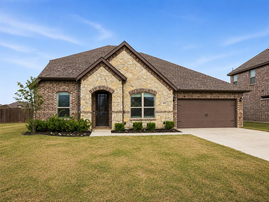 Discover the perfect blend of space, comfort, and flexibility in this beautifully designed 4-bedroom, 4-bath home located in the highly sought-after Krum ISD. Featuring a unique split-bedroom floor plan, every bedroom enjoys its own private space away from the others, and each bedroom has convenient access to a full bathroom, making this home ideal for multigenerational living, guests, or growing families. The main level includes the spacious primary suite, two secondary bedrooms, a dedicated home office, and a private media room with upgraded insulation for an exceptional movie-watching experience. The inviting family room is anchored by a stunning floor-to-ceiling stone fireplace and flows seamlessly into the open-concept kitchen and dining areas, creating the perfect setting for everyday living and entertaining. Wood-look tile flooring throughout the main living areas and plantation shutters on every window add timeless style, durability, and abundant natural light. Upstairs, you'll find a spacious game room, a fourth bedroom, and a full bath, offering the perfect private retreat for guests, teens, or extended family. Situated on a desirable corner lot, the large backyard with a covered patio provides plenty of room to relax, entertain, or play. Conveniently located near Krum schools, shopping, dining, and major commuting routes, this move-in ready home offers a rare combination of thoughtful design, versatile living spaces, and modern comfort.