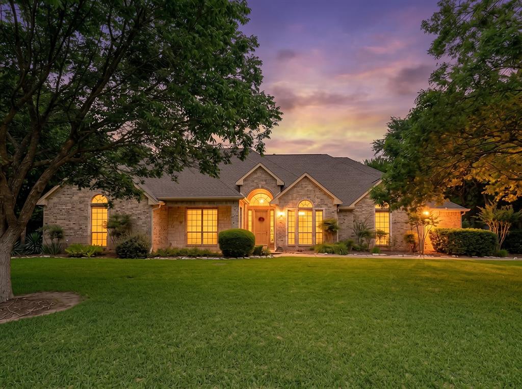 Nestled on a serene 1.15-acre treed lot, this stunning home invites you into a world of elegance and comfort.The charming exterior hints at the beauty that lies within.You are greeted by a warm, welcoming entryway adorned with rich wood floors that seamlessly flow through the hallways, kitchen,and dining areas.The heart of the home is a beautifully designed space where the family room effortlessly connects to the gourmet kitchen. Here,you’ll find an electric cooktop,built-in oven, and microwave,complemented by a large custom island and ample cabinetry. This culinary haven is perfect for family gatherings or entertaining friends, especially with easy access to both the formal dining and breakfast areas.The master suite, tucked away for privacy at the back of the home,serves as your personal retreat,elegant trey ceilings and private access to the back patio, it offers peaceful views of the lush surroundings.The spa-like ensuite is a luxurious escape, featuring dual sinks, a makeup vanity, walk-in shower,soaking tub, along with a massive walk-in closet. Two large secondary bedrooms, thoughtfully located behind the kitchen, share a well-appointed Jack and Jill bathroom with separated vanities, ensuring privacy for everyone.A cozy study downstairs offers a quiet workspace,while the game room or second living area upstairs, complete with a half bath and wet bar,is perfect for hosting movie nights or game days.As you step outside, the covered back patio becomes your favorite spot for relaxation or entertaining, seamlessly integrated into the home for a high-end appeal. The beautifully landscaped backyard, dotted with mature trees, creates a tranquil oasis where you can unwind and enjoy nature.For added convenience and low maintenance, an 18-zone sprinkler system draws from a water well on the property, ensuring your landscaping remains vibrant year-round. Additionally, a versatile 22x30 shop with a split unit offers endless possibilities for storage, hobbies, or workspace.