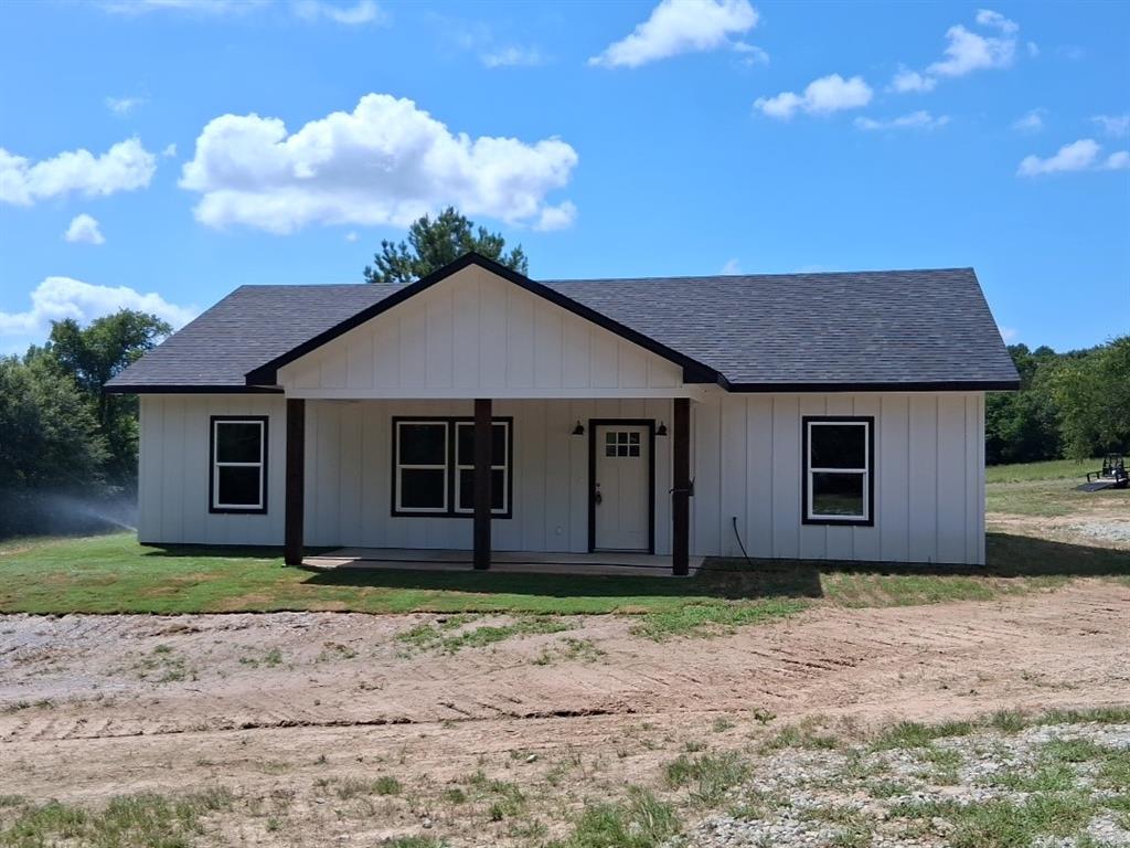 GREAT OPPORTUNITY AT AN AMAZING PRICE!  New build located just outside the city limits with no restrictions, this beautiful 3-bd 2-bth home is nicely situated on 4.1 acres with mature trees and a spring-fed pond offering scenic views of the sloping landscape.  Relax on your back patio while taking in the natural beauty and enjoy watching deer and wildlife.  Lots of natural light filter into the open floor plan that features 9' ceilings and flows seamlessly into the spacious kitchen complete with large island with overhang for eat-in breakfast bar, solid wood cabinets, granite counter tops, stainless appliances and dining area.  Just off the kitchen is a large laundry-mudroom with plenty of extra storage space.  Master bedroom has large walk-in closet and ensuite bath, custom tile in bathrooms, decorative lighting & fixtures, and vinyl plank flooring throughout.  Quality construction and attention to detail define this home built on post-tension slab and features spray foam insulation.  Located minutes from downtown Emory and dining, shopping, medical, etc.  Builder offering assistance with rate buydown.  Listing Agent is managing partner of Phillips Sousa Investments LLC.  Information deemed reliable but should be verified by Buyer and Buyer’s agent.