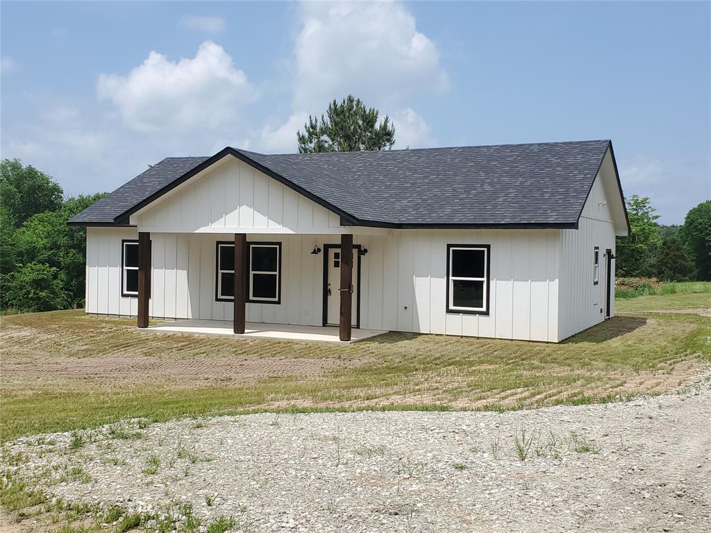 GREAT OPPORTUNITY AT AN AMAZING PRICE!  New build located just outside the city limits with no restrictions, this beautiful 3-bd 2-bth home is nicely situated on 4.1 acres with mature trees and a spring-fed pond offering scenic views of the sloping landscape.  Relax on your back patio while taking in the natural beauty and enjoy watching deer and wildlife.  Lots of natural light filter into the open floor plan that features 9' ceilings and flows seamlessly into the spacious kitchen complete with large island with overhang for eat-in breakfast bar, solid wood cabinets, granite counter tops, stainless appliances and dining area.  Just off the kitchen is a large laundry-mudroom with plenty of extra storage space.  Master bedroom has large walk-in closet and ensuite bath, custom tile in bathrooms, decorative lighting & fixtures, and vinyl plank flooring throughout.  Quality construction and attention to detail define this home built on post-tension slab and features spray foam insulation.  Located minutes from downtown Emory and dining, shopping, medical, etc.  Builder offering assistance with rate buydown.  Listing Agent is managing partner of Phillips Sousa Investments LLC.  Information deemed reliable but should be verified by Buyer and Buyer’s agent.