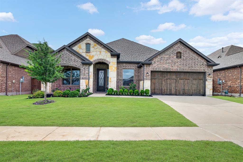 Where thoughtful design meets exceptional indoor-outdoor living, this beautifully upgraded one-story home in Trinity Falls delivers style, comfort, and functionality at every turn. From the French office doors and crown molding throughout to the soaring cathedral ceilings, designer lighting, and luxury finishes, every detail has been carefully curated to create a home that feels both elegant and inviting. The open-concept living area is filled with natural light and anchored by a stunning fireplace, while the chef-inspired kitchen features granite countertops, stainless steel appliances, abundant cabinetry, under-cabinet lighting, a stylish backsplash, and an oversized island perfect for gathering. The private primary retreat offers a beautiful bay window,  tray ceilings and a spa-like ensuite with dual vanities, extensive drawer and cabinet storage, a soaking tub, and a glass-enclosed shower with a built-in bench. Designed for seamless entertaining, a dramatic 15-foot sliding glass door opens to an expansive covered patio complete with a ceiling fan and outdoor fireplace, creating the ultimate year-round outdoor living space. A spacious game room adds flexibility for entertaining, movie nights, or hobbies, while luxury flooring, an extended garage, water softener system, and numerous builder upgrades enhance everyday comfort. Nestled in the award-winning Trinity Falls master-planned community, residents enjoy resort-style pools, parks, playgrounds, scenic trails, and a vibrant lifestyle just minutes from shopping, dining, and top-rated schools. Sophisticated design, exceptional entertaining spaces, and an unmatched Trinity Falls lifestyle make this home truly stand out.