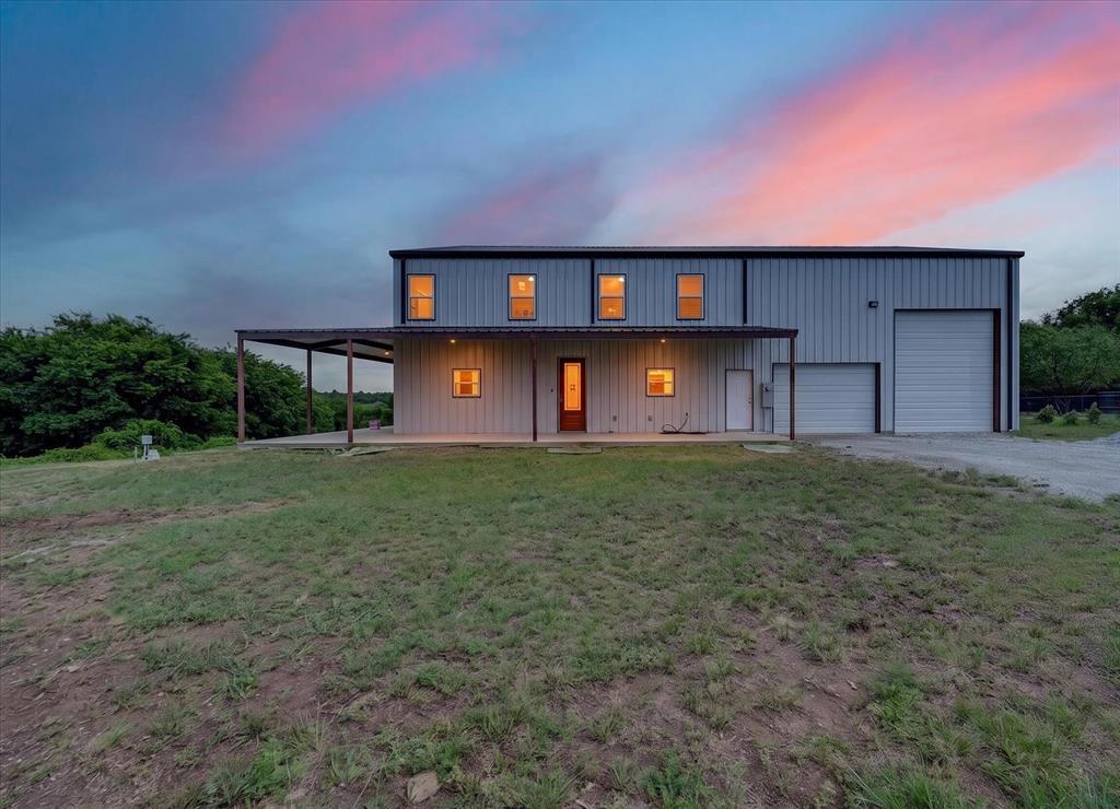 ** $15,000 in Seller Concessions Offered ** Experience Texas country living at its finest with this stunning custom barndominium situated on 10 acres (9 Ag Exempt) in Grandview. Located at 528 Hill Country Road 4411, this one of a kind property combines modern comfort, expansive living space, and a massive shop for the ultimate work play lifestyle.

Step inside to soaring 19 foot ceilings and an impressive open concept design filled with natural light. The spacious living, dining, and kitchen areas create the perfect setting for entertaining or everyday living while showcasing breathtaking views of the surrounding countryside. The home features 3 bedrooms, 2.5 bathrooms, including a private downstairs primary suite with a luxurious ensuite bath and walk-in closet.

Outside, the property truly shines with a 35' x 50' shop garage complete with oversized doors and dedicated RV parking, providing ample space for vehicles, equipment, hobbies, or a home business. The covered wrap around porch offers the perfect place to enjoy peaceful sunsets and panoramic views across the rolling acreage.

Whether you're looking for a private homestead, hobby farm, or a versatile property with room to grow, this exceptional barndominium delivers the best of rural living while remaining conveniently located near Grandview, Hillsboro, and the DFW Metroplex.

Property Highlights:

3 Bedrooms, 2.5 Bathrooms
Downstairs primary suite with ensuite bath
Soaring 19' ceilings throughout
Open concept living, kitchen, and dining areas
35' x 50' shop garage
RV parking
Covered front porch
10 acres
Scenic country views and abundant privacy
Convenient access to Grandview and the DFW area

** Due to some incomplete trim and tile work, the sellers are offering $15,000 in seller concessions right up front. Use it to lower your cash to close or buy down points. It's yours to use as you please.