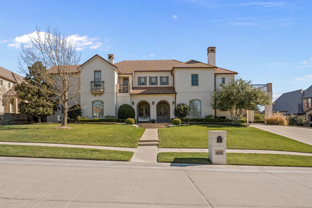 Nestled in the exclusive, gated, and 24-hour guarded community of Montserrat, this exquisite home embodies elegance, style, and unparalleled craftsmanship. Designed for both entertaining and everyday comfort, the spacious floor plan is adorned with timeless finishes throughout. The kitchen is a chef’s dream, featuring Wolf and Sub Zero appliances and an open layout that seamlessly flows into the living area, highlighted by vaulted wood-beamed ceilings and a wall of glass doors overlooking the pool. A centrally located butler’s pantry, complete with a full-size wine refrigerator, connects the kitchen to the formal dining room. The primary suite offers a private retreat with dual vanities, a double shower, and a freestanding soaking tub. The main level also boasts a library or additional living area with custom built-ins and a coffered ceiling, a formal dining room, a spacious laundry room, a mudroom with a dedicated workspace, and two half bathrooms. Take the staircase or elevator to the second floor, where a loft-style living area leads to four spacious bedrooms, each with an ensuite bath. An impressive game room, complete with a wet bar kitchenette, half bathroom, and access to a balcony overlooking the resort-style backyard. Designed for year-round enjoyment, the backyard features a covered outdoor living and grilling area, half bathroom, a fireplace, a pool and spa, a putting green, a secret garden, an all-turf lawn and a 4-car garage.