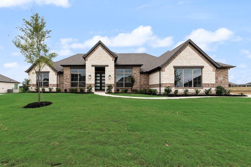 MLS# 21266621 - Built by Risewell Homes - Ready Now! ~ This thoughtfully designed single-story home in New Fairview offers a spacious and flexible layout that balances everyday comfort with standout features. At the heart of the home, the open family room, kitchen, and breakfast area create an inviting gathering space, enhanced by a sleek electric fireplace that adds warmth and visual impact. The kitchen is well-positioned for both entertaining and daily living, with generous workspace and convenient access to the utility room and pantry. The private primary suite is a true retreat, featuring a luxurious bath and a large walk-in closet designed for ease and relaxation. Three additional bedrooms and two full baths provide comfortable accommodations for family or guests, while a dedicated study near the foyer offers a quiet, versatile space for work, hobbies, or learning. A flex room adds even more adaptability to the layout, and the covered patio extends the living space outdoors for effortless entertaining or unwinding. With a three-car garage and a layout designed to feel both open and purposeful, this home delivers style, functionality, and room to grow, all wrapped into one impressive design.