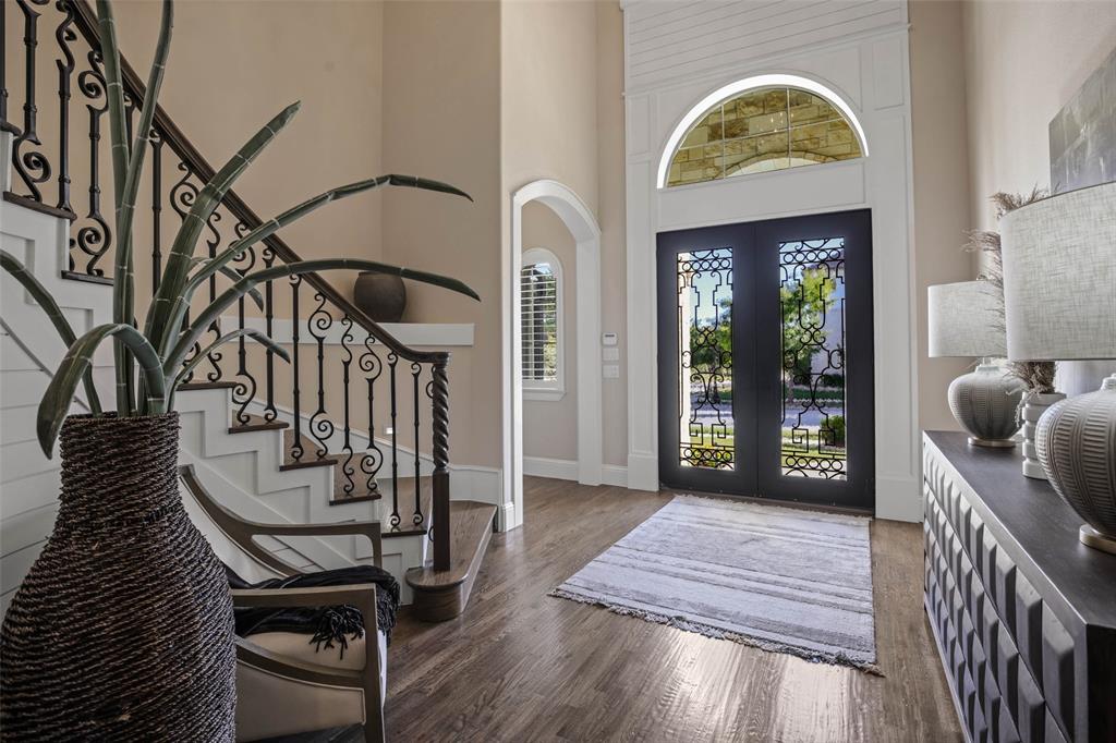 PRICE ADJUSTMENT on this stunning custom-built property situated on a spacious lot in the desired Carillon community.  As you step inside, you’re greeted by an open concept floor plan that seamlessly flows, connecting the gourmet kitchen with the eating area and family room; providing a great space for entertaining and relaxation.  A game room and guest suite down add to the home's livability. The beautiful finishes throughout include rich hardwoods, neutral tones, designer lighting, custom cabinetry, and plantation shutters, just to name a few. The landscaped back yard with covered patio, outdoor kitchen and roll down screens is a great area for play, grilling and entertaining.  End the day in the serenity of your luxurious master suite complete with a spacious sitting area and beautifully appointed ensuite bath. With its amazing location in Southlake, with excellent access to highways, the DFW airport, shopping and restaurants, this home is the epitome of luxury living - A MUST SEE!