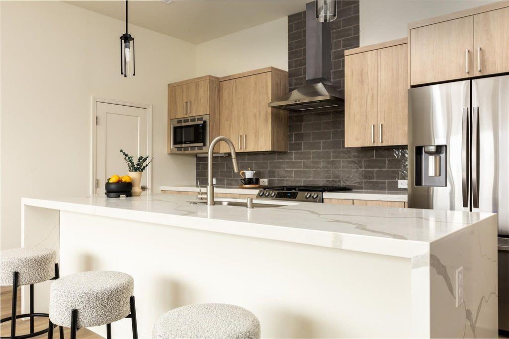 Built in 2021, this contemporary 2-bedroom, 2.5-bath condo offers 1,730 square feet of thoughtfully designed living space in the heart of The Cedars, one of Dallas’ fastest-growing neighborhoods. Located just minutes from Downtown Dallas, the Dallas Farmers Market, local coffee shops, restaurants, and entertainment, this home combines modern living with exceptional convenience. The open-concept floorplan is designed for both everyday living and entertaining, featuring spacious living and dining areas, oversized windows with abundant natural light, and modern finishes throughout. The kitchen opens seamlessly into the main living space, while both bedrooms offer generous layouts, walk-in closets, and ensuite bathrooms for added privacy and functionality. A convenient half bath completes the main living area. The unit is currently tenant occupied. The existing tenant is open to either extending the lease or vacating depending on the buyer’s preference, creating flexibility for a variety of ownership opportunities.