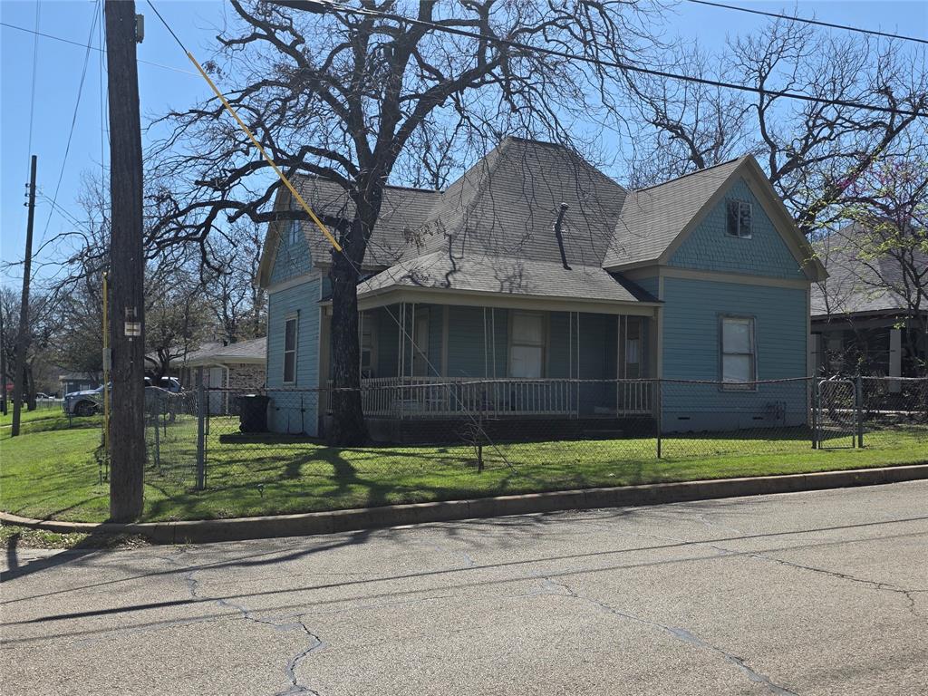 So many options. Handyman special.  Full of possibilities and packed with potential, this home with 2-bedroom, 1-bath and a large  living and dining room in Cleburne can be yours.  Whether you’re looking for your 1st home, wanting to down size or build your investor portfolio. This home is ready for a new owner to add their personal touch and restore its full sparkle. Home features a large kitchen. Utility room for full washer and dryer. hard wood floors.  Large attic space that could be renovated into a 3rd bedroom. Nice fenced yard with wrap around porch. Conveniently located near schools, parks, shopping, and downtown amenities. Home is leased to long time tenant. Home can also be packaged with 4 other homes that are offered for sale as well. All MLS# for properties offer for sale 21211282, 21211302, 21214411. 21214430 and 21214445. Home and property are being sold “as-is” “where-is”.