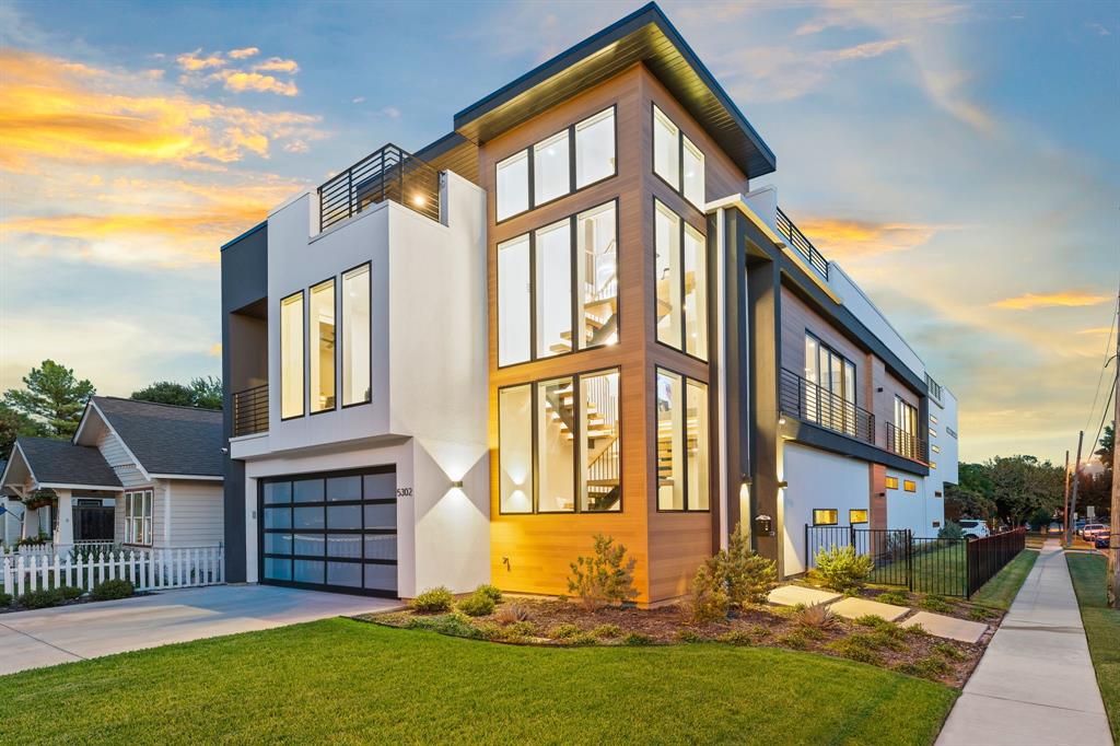 Welcome to this one-of-a-kind modern home on a prime corner lot in Vickery Place, conveniently located near upscale restaurants and shopping. Featuring 4 bedrooms, 4.5 baths, and a versatile flex room, this residence is both spacious and stylish. The stunning pool and outdoor areas invite relaxation and enjoyment. The rooftop patios offer impressive downtown views, perfect for unwinding or hosting friends. A striking floating steel staircase, surrounded by windows and a gorgeous chandelier, leads you to the rooftop retreat. Inside, the living and dining rooms boast soaring 28-foot ceilings, creating a bright and airy atmosphere. With 11 outdoor patio areas and an amazing pool, this home is designed for outdoor living while ensuring privacy with two separate yards. Two staircases provide convenient access, one leading to the luxurious master suite and a soothing sauna. This home beautifully blends modern design with comfort, making it a perfect sanctuary for any lifestyle.