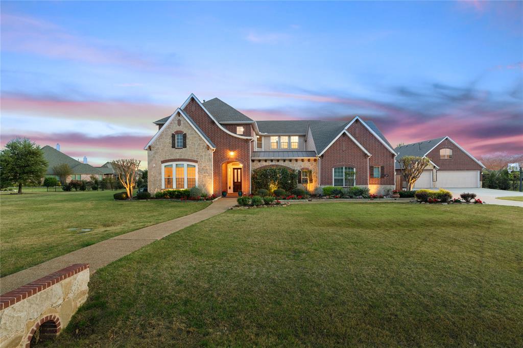 Have you been seeking a little extra space for your family? This custom estate with 3 car garage guest house is situated on over 1.5 acres in highly sought after Lucas, Tx. North facing, this property features over 6,000 square feet with 6 total bedrooms, multiple living areas, media room, guest quarters, and a picturesque backyard designed for entertaining. The grand entry welcomes you with soaring ceilings and pristine finishes. Amazing open floor plan includes spacious living areas, large windows overlooking the backyard, private formal office, fine dining, and a chef’s kitchen with large island, abundant cabinetry, and open concept design perfect for entertaining. Updated movie theatre room provides a true in home media experience. This home also features additional entertainment and sleeping quarters ideal for guests, multigenerational living, or flexible space. Backyard is a private retreat featuring a resort style pool and spa, water features including gratto style waterfall, dual fire pit for nighttime ambience, outdoor living space, and upgraded turf areas providing low maintenance landscaping and expanded entertainment space.  Backyard fence has been heavily lined with added pine trees for privacy. The large lot offers space, and room to enjoy outdoor living. Additional features include oversized garage with wall lined cabinets and epoxy treatment, 6 spaces in total with multiple electric vehicle chargers installed, room for a neighborhood golf cart, multiple staircases, 10x10 gunsafe room, hidden rooms, large secondary bedrooms, ensuite bathrooms, and extensive storage throughout the home. This property offers luxury, space, privacy, and entertainment both inside and outside in one of Lucas’s most desirable communities and situated on one of the best lots in the neighborhood.  Just 5 minutes from Lake Lavon walking trails, and 20 minutes to downtown Dallas. 5 bedrooms and 5 Full Bathrooms in main house, 1 Bedroom and 1 full bathroom in guest house.