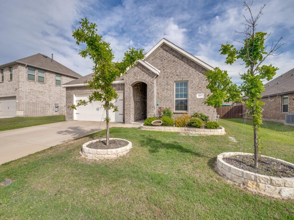 Modern living meets country charm in Caddo Mills! This 4 bed, 2 bath home offers quick access to I-30 and is located in a newer community with pool, pond, walking trails, parks, and playground. Inside, you’ll find a thoughtfully designed split-bedroom layout with an open-concept living space and a sleek modern decorative fireplace. The kitchen features quartz countertops, large island, gas range, and walk-in pantry—perfect for everyday living and entertaining. Enjoy added efficiency with a tankless water heater. Spacious secondary split bedrooms offer flexibility for guests or a home office. Relax on the covered front porch or unwind on the back patio. Zoned to top-rated Caddo Mills ISD. A perfect blend of comfort, style, and community amenities with a peaceful country feel close to city conveniences.