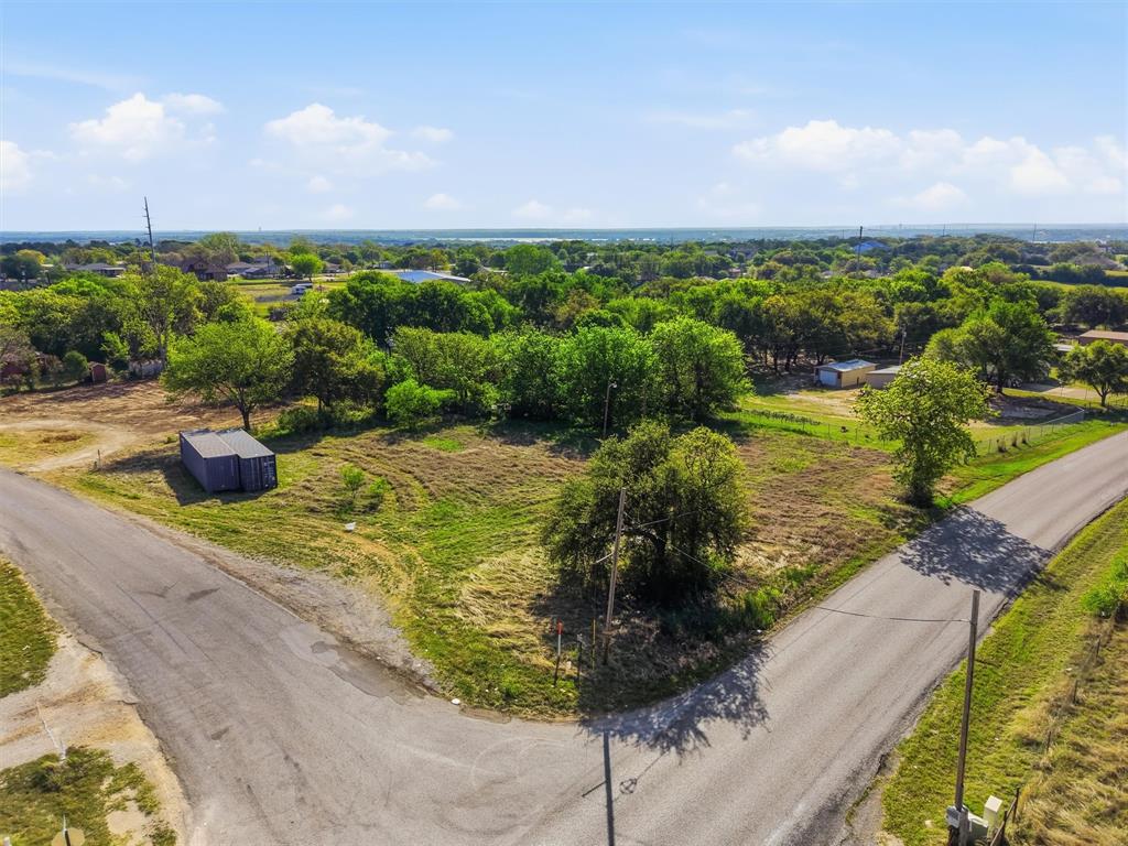 Owner carry available for approved buyers! Positioned on the corner of Davis Road and Sundown Trail, this .67-acre commercial offering includes three combined lots in a highly accessible location just 1.8 miles off Hwy 377. With strong visibility and convenient access, this property is well-suited for a variety of commercial uses. Perfect location for a warehouse, storage facility, Office complex, or other commercial activities! Whether you're looking to build, invest, or expand your business presence, this is a great opportunity in a growing area with steady traffic and nearby development.