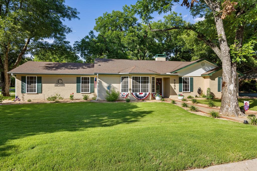Tucked beneath towering shade trees, this beautifully updated 3-bedroom, 2-bath home offers the lifestyle you've been searching for. Inside, you'll find an inviting living space featuring updated flooring throughout, a spacious living room with fireplace, and a refreshed kitchen with butcher block countertops, subway tile backsplash, stainless appliances, and abundant cabinetry. Step outside to a backyard built for making memories with a covered patio, firepit area, fenced yard, and private sport court perfect for pickleball, basketball, or family fun. Situated in Pecan Plantation, community, residents enjoy access to golf, tennis, swimming pools, marina facilities, parks, dining, and more. This is a rare opportunity to enjoy both comfort and community in one exceptional package.
