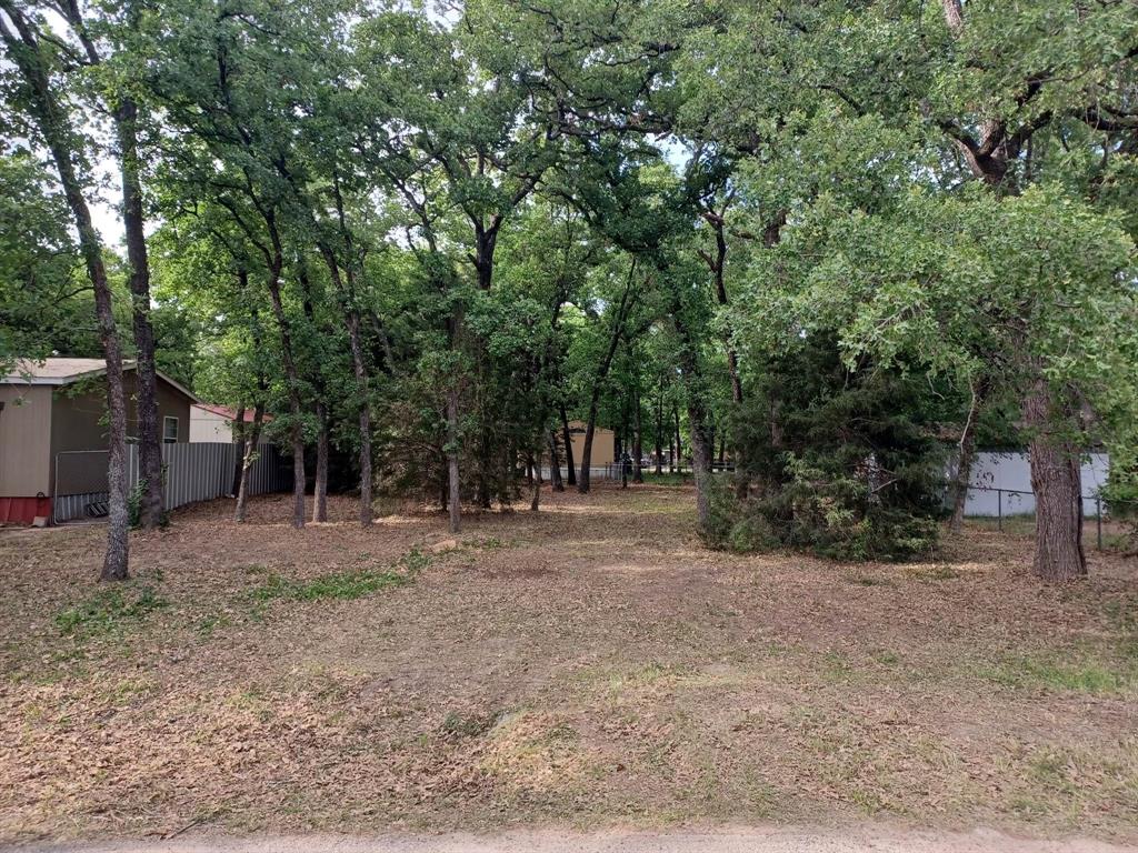 Land is priced to sell. If you're looking to build or bring your pre-manufactured home, the Wood-Wilks Gardens subdivision is a fantastic opportunity that offers endless possibilities. With both types of homes welcomed, you can create a home that's perfect for your unique needs and preferences. One of the standout features of this lot is its location, which offers close proximity to highly rated schools and Cedar Creek Lake Reservoir. Families will love the educational and recreational opportunities that are easily accessible. Additionally, the convenience of nearby shopping and dining options makes it easy to run errands and have fun. Another significant advantage of this lot is that it already has city water and sewer available. This eliminates the need for costly and time-consuming drilling of a well or installation of a septic system. Brand new survey available.