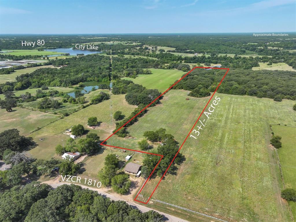 Beautiful AG exempt 13.01 (approx) acre tract located just outside the city limits of Grand Saline.  Part of a 3 parcel tract totaling 38.99 acres. Great location, just minutes from town and less than 90 minutes to Dallas, 45 minutes to Tyler, 20 minutes to Canton, 15 minutes to Mineola and close to Lake Fork.  Close to shopping, schools and dining.  Partially wooded, with a picturesque pond, nestled among the trees, ideal for fishing, wildlife watching, or simply enjoying the view. The topography of the land is predominantly level, providing ease of access and potential for various uses such as farming, ranching, or residential construction.  Electricity available.  No city taxes.  Enjoy the beauty of the East Texas countryside with abundant wildlife, serene nature, and a country atmosphere.  The land is currently AG exempt and has lots of wide open pasture making site prep easy and straightforward.  This property is ready for whatever you have in mind from a weekend escape, to building a home, starting a farm, development, or just a future investment. No mobile or manufactured homes allowed.  See MLS #21141932 and MLS #21141930 for information on the other two lots.
