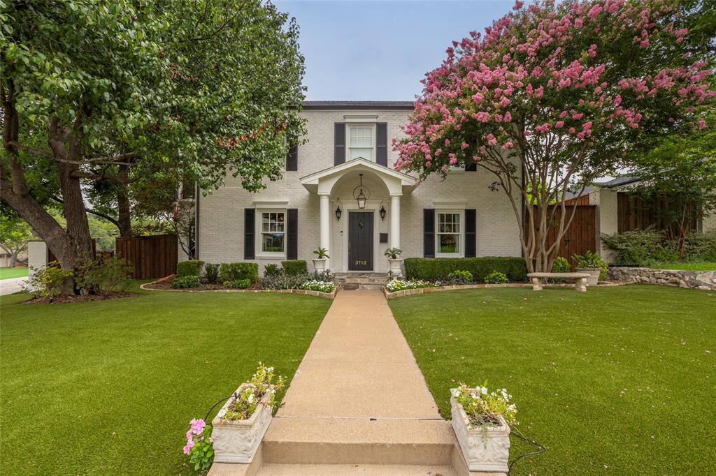 Situated on a landscaped corner lot in Monticello, this updated 1936 residence embodies the timeless character for which the neighborhood is known. Classic architectural details, curated interiors, and inviting outdoor spaces create a home that feels both elegant and welcoming.

Flanking the front entry are a lacquered blue formal living room with a fireplace and a bright formal dining room, both enhanced by custom millwork, designer wallpaper, and natural light. An elegant arched hallway with painted wood paneling creates a transition into the heart of the home.

The bright kitchen features marble countertops, a center island, stainless steel appliances, a walk-in pantry, and a breakfast room. A widened opening connects the kitchen to the spacious family room with a built-in bar and also serves as an entry from the covered side patio, the detached garage, and gated access to Dorothy Lane. A laundry room and powder bath complete the first floor.

Upstairs, a generous game room offers flexible living space, along with three bedrooms and two full bathrooms. The primary suite serves as a private retreat with a fireplace, dual vanities, a soaking tub, a walk-in closet, and a covered balcony overlooking the side yard. One secondary bedroom also enjoys private balcony access.

Outside, the backyard has been transformed into a private oasis. Turf throughout, a putting green, pool and spa, mature shade trees, drip irrigation, and a built-in MosquitoNix system create a setting designed for enjoyment. The detached two-car garage is complemented by a covered outdoor kitchen with a sink, bar seating, a pool bath, and an outdoor shower, ideal for entertaining.

With gated access from Dorothy Lane, beautiful architectural details throughout, and a corner-lot setting framed by mature landscaping, this classically elegant home offers the warmth, character, and livability that continue to make Monticello one of Fort Worth's most beloved neighborhoods.